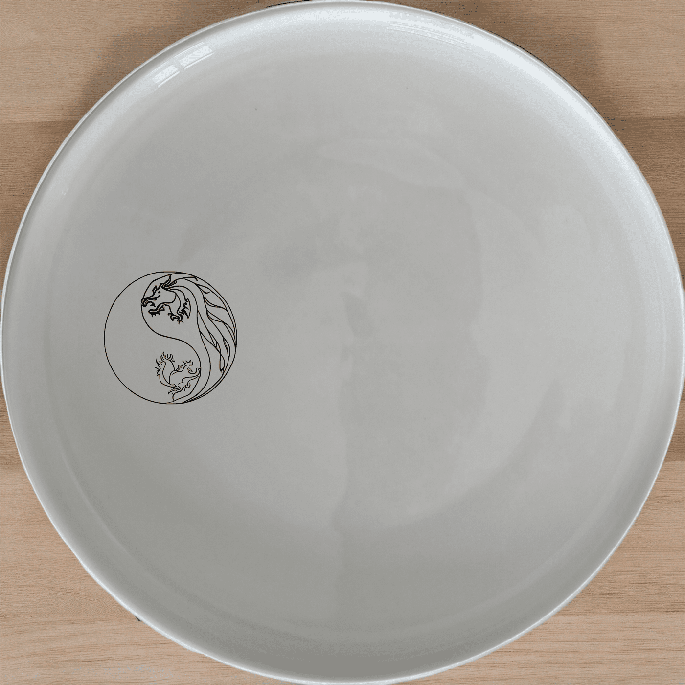 Yingyang Chinese Dragons Side Plate Set of 4 - Range 2 is a beautifully designed set of four white ceramic plates, each featuring an intricate yin-yang dragon design, perfect for adding a touch of elegance to any dining table.