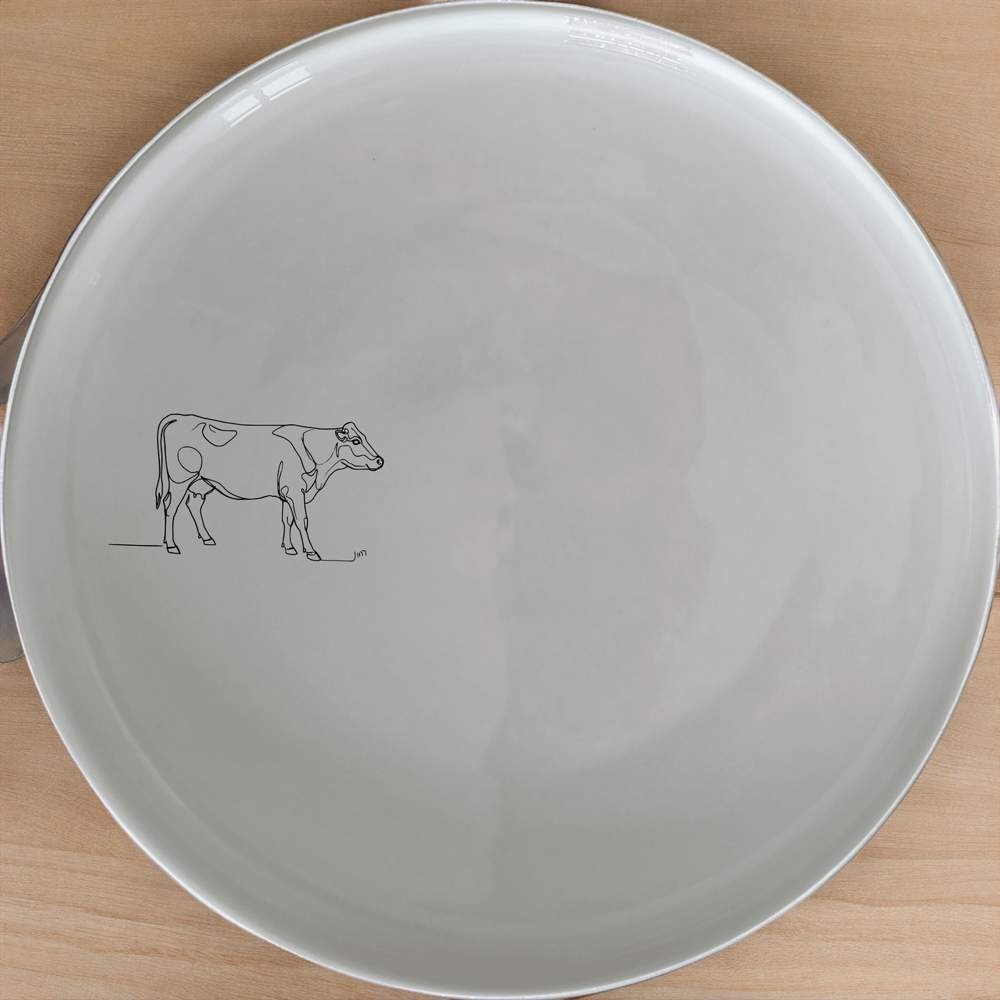 Farm Cow Side Plate Set of 4 - Range 1 adds a rustic charm to your dining table with its minimalist design and elegant simplicity.