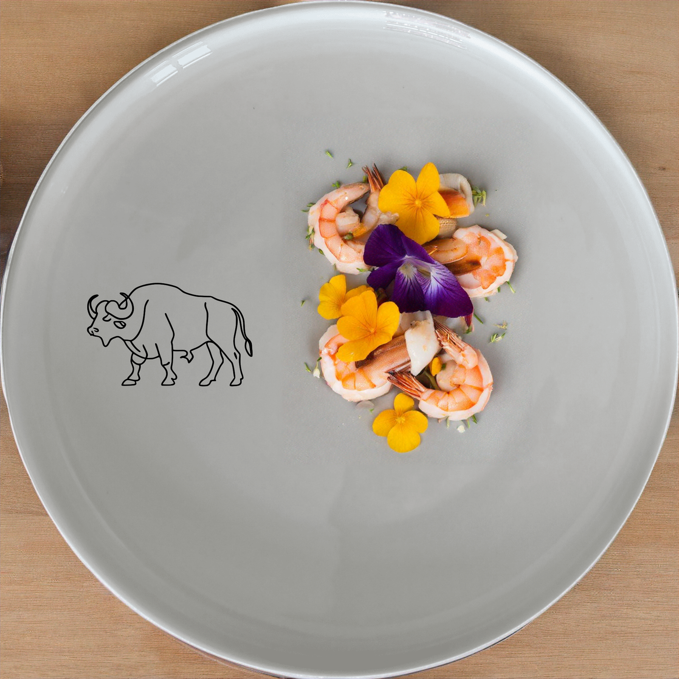 African Buffalo Dinnerware Set of 12 - Range 4 is a stylish and durable ceramic dinner set featuring a bold African buffalo design, perfect for everyday use or special occasions.