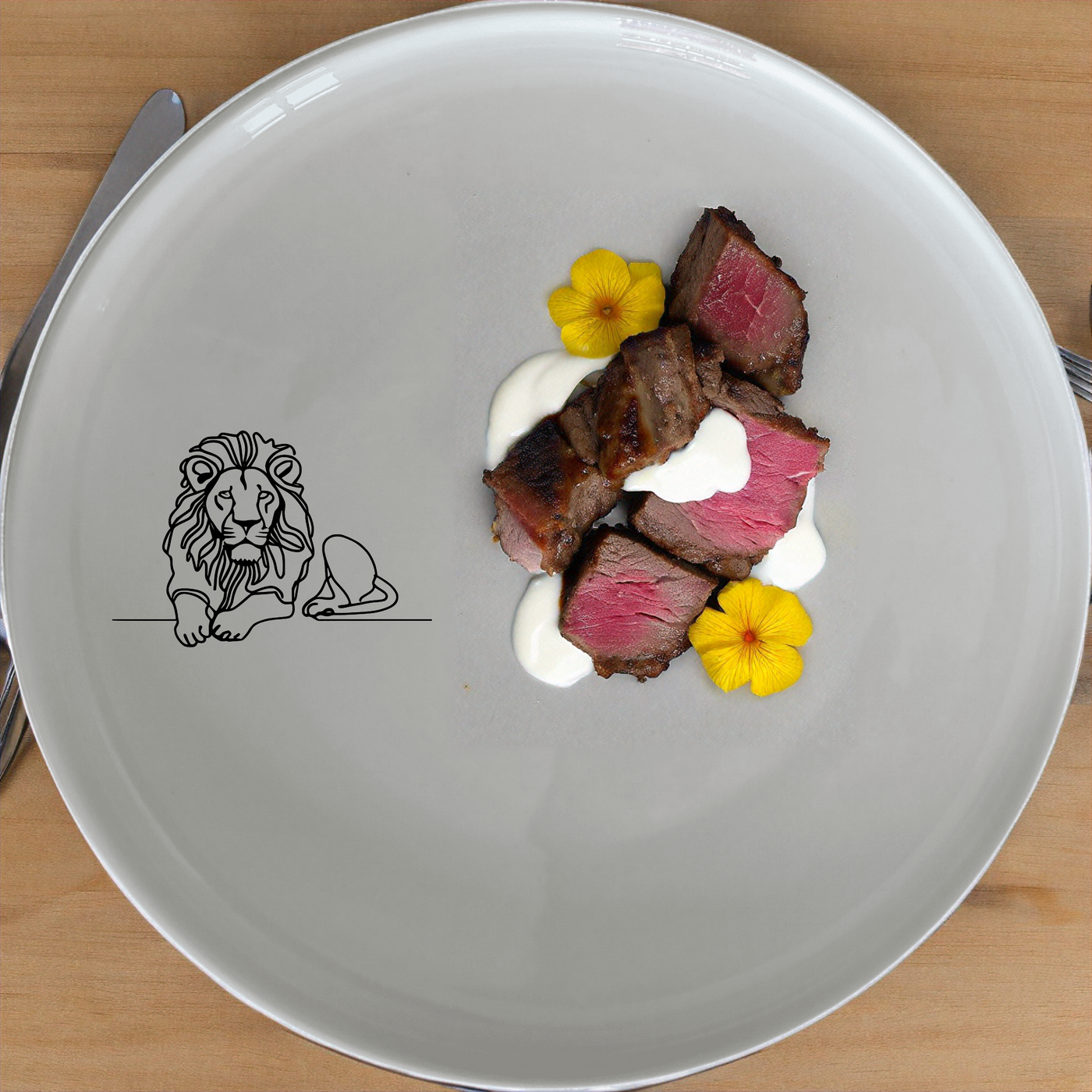 The African Lion Dinnerware Set of 12 - Range 1 features sleek, modern design with a subtle lion motif, perfect for elevating any dining experience.