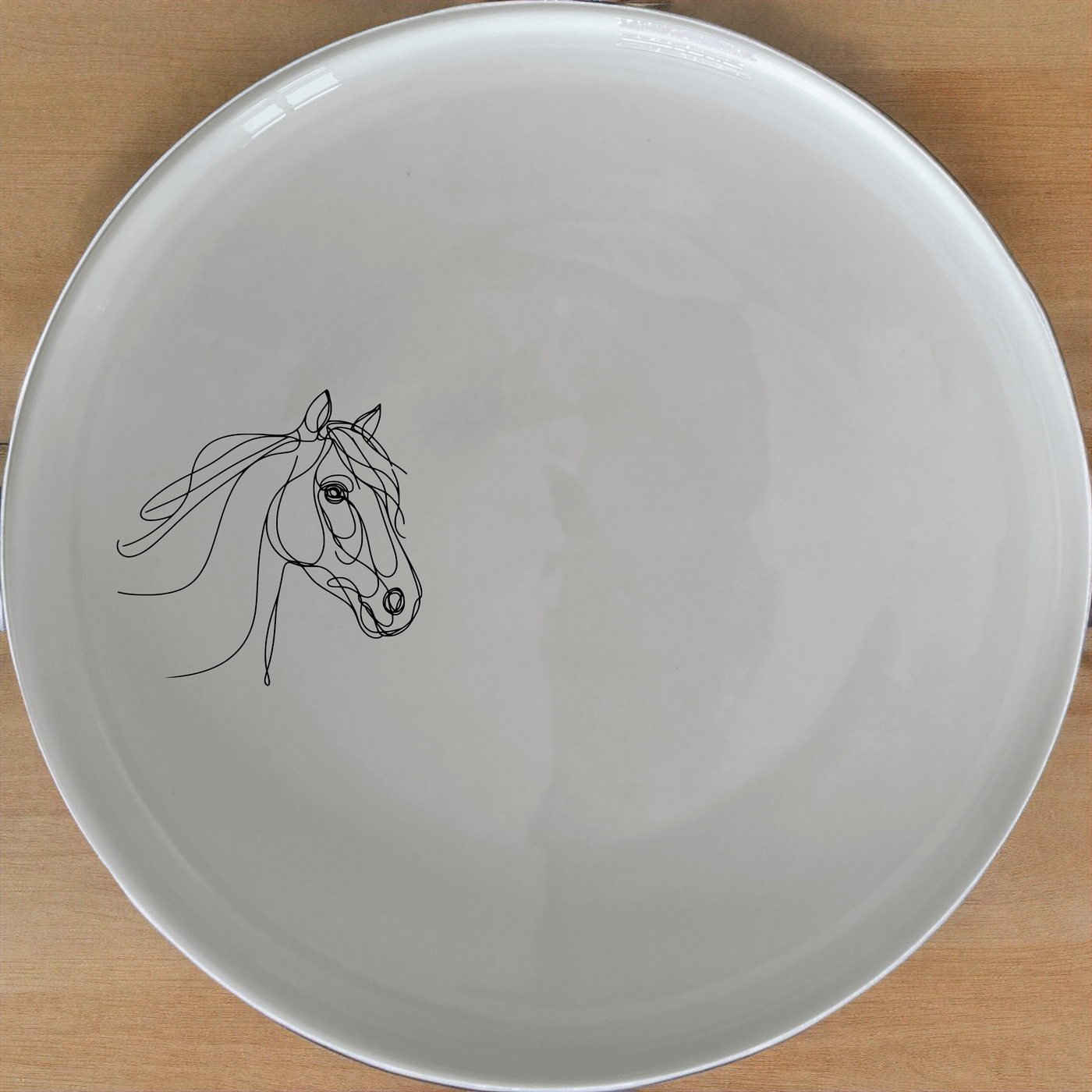 Artistic Horse Dinner Plate Set of 4 - Range 1 is a stunning collection of four elegant dinner plates featuring a minimalist horse design. Perfect for any dining occasion.