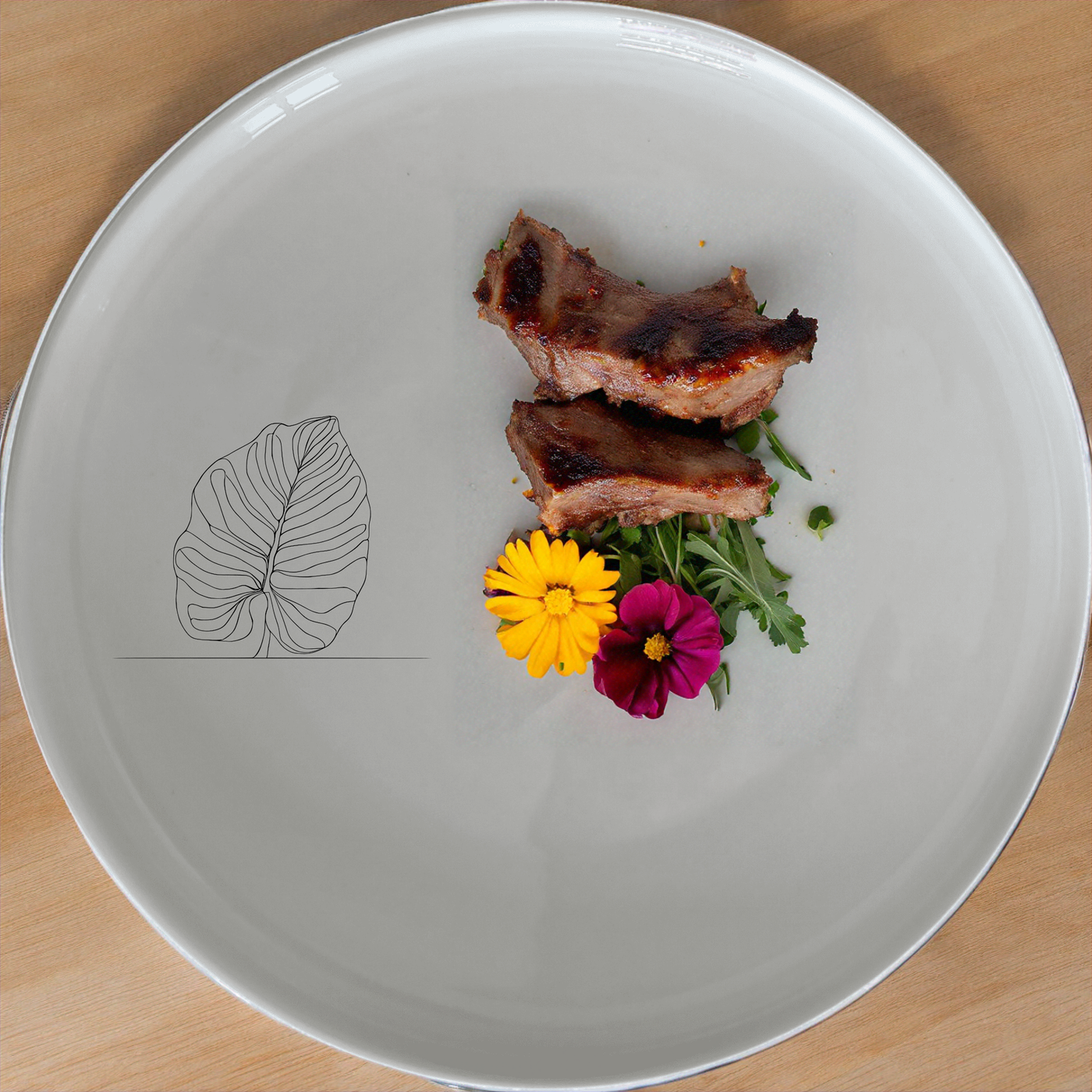 The Calathea Orbifolia Dinnerware Set of 12 - Range 3 brings a touch of nature to your dining table with its elegant design and versatile pieces.