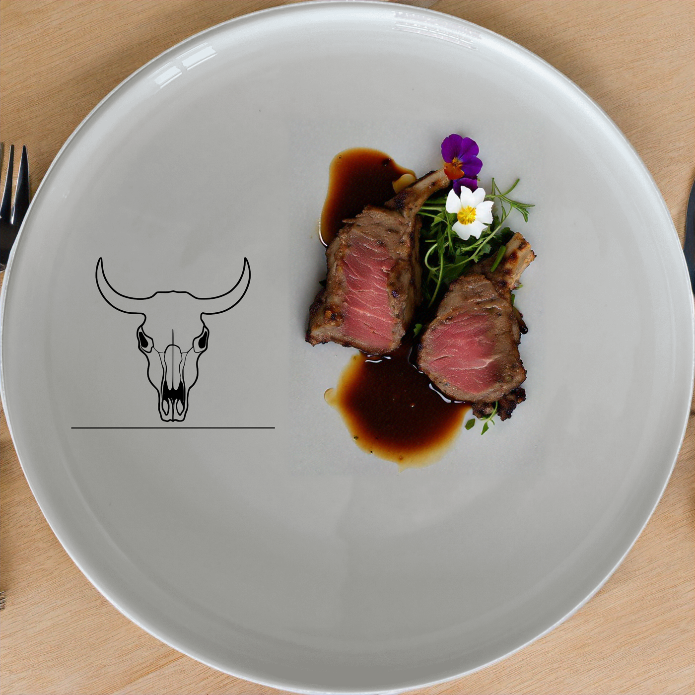 The Frontfacing Cow Skull Dinnerware Set of 12 - Range 3 adds a bold, artistic touch to your dining experience with its sleek design and striking skull motif.