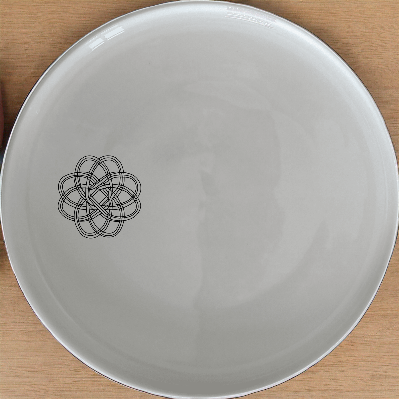 Geometric Knots Side Plate Set of 4 - Range 2 is a stylish and modern addition to your dining table, perfect for everyday use or special occasions.