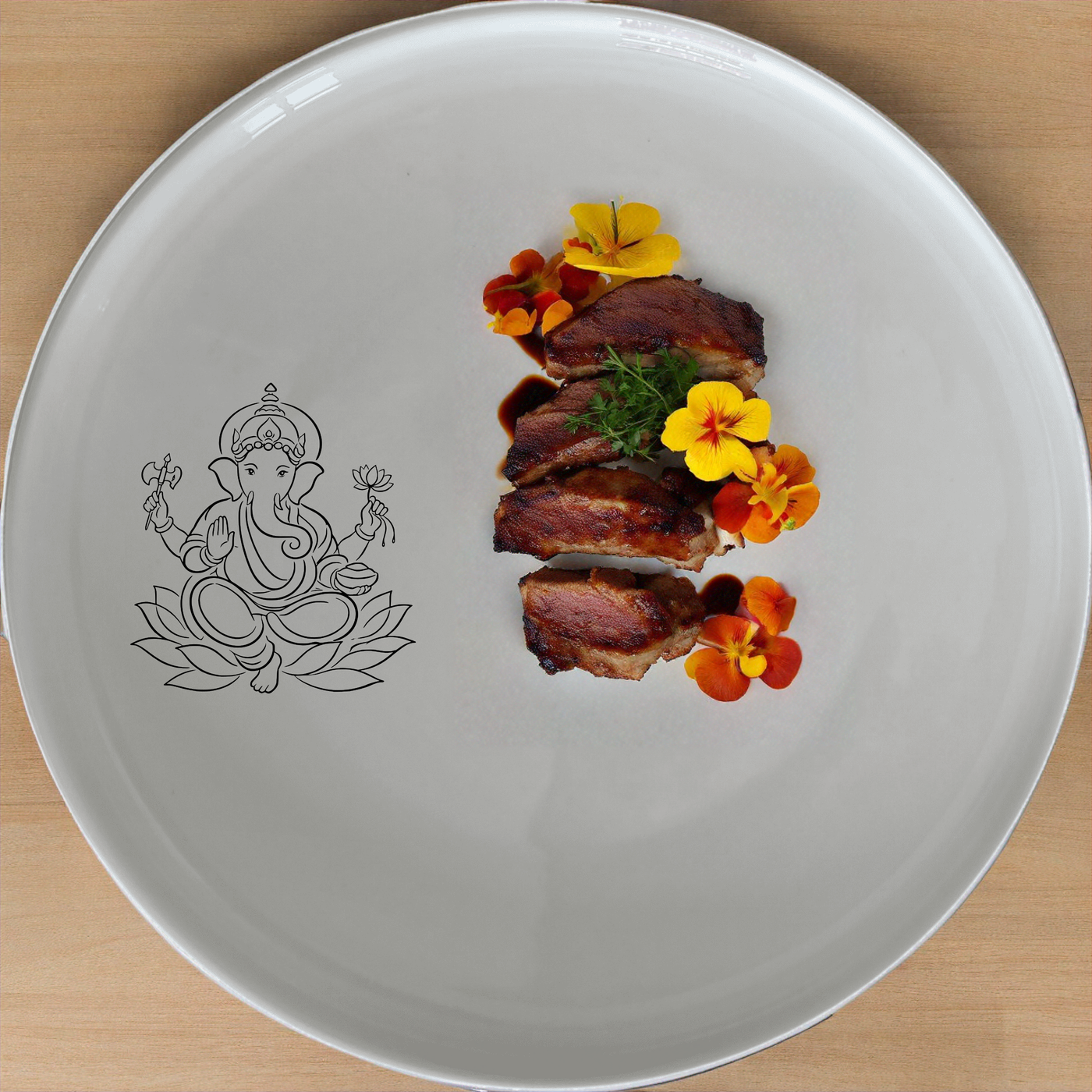 The Lord Ganesha Hindu God Dinnerware Set of 12 - Range 1 is a beautifully crafted set featuring intricate designs inspired by Hindu mythology. This set includes four dinner plates, four side plates, and four bowls, each adorned with the serene image of Lord Ganesha.
