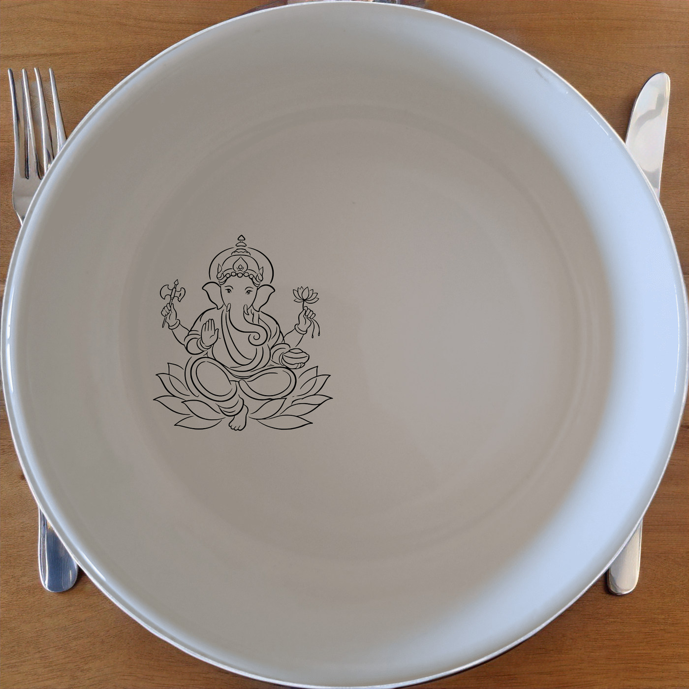 Lord Ganesha Hindu Bowl Set of 4 - Range 1 is a beautifully designed set of four white ceramic bowls featuring the iconic image of Lord Ganesha. Perfect for everyday use or special occasions, these bowls add a touch of spiritual elegance to your dining table.