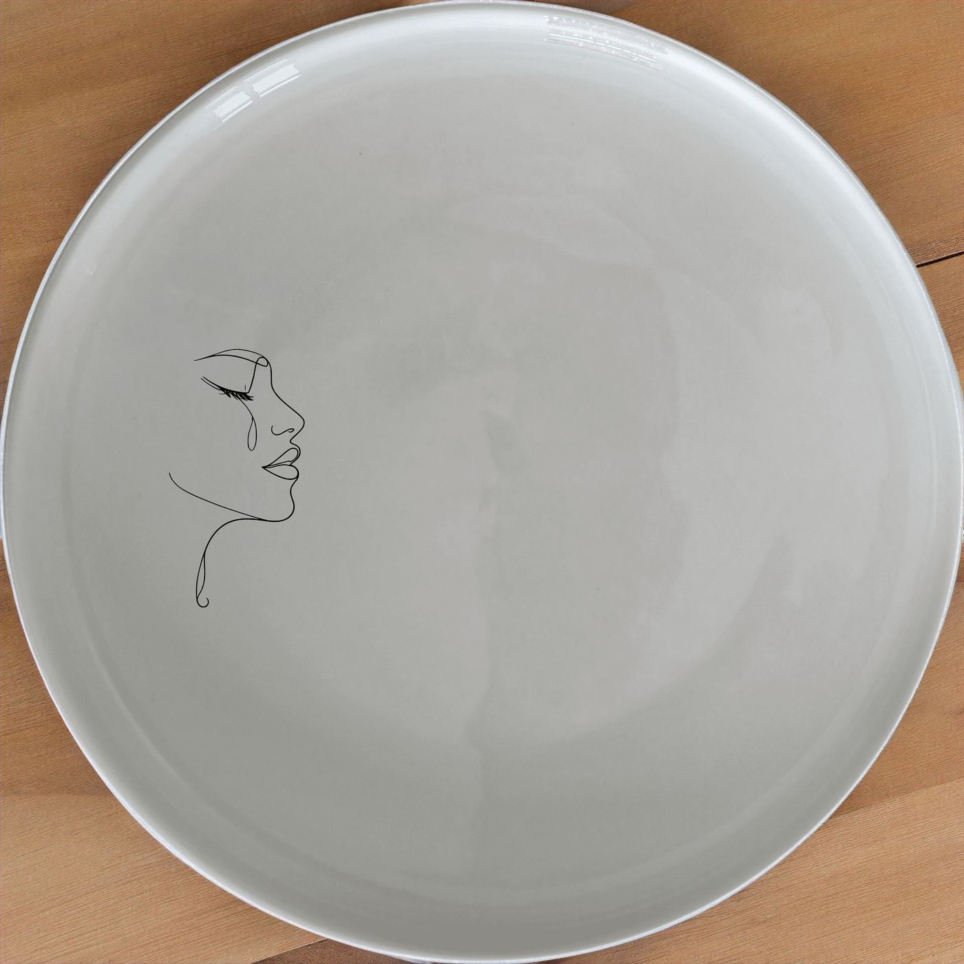 Minimalist Woman Face Side Plate Set of 4 - Range 1 is a stylish and modern addition to any dining set, perfect for contemporary homes.