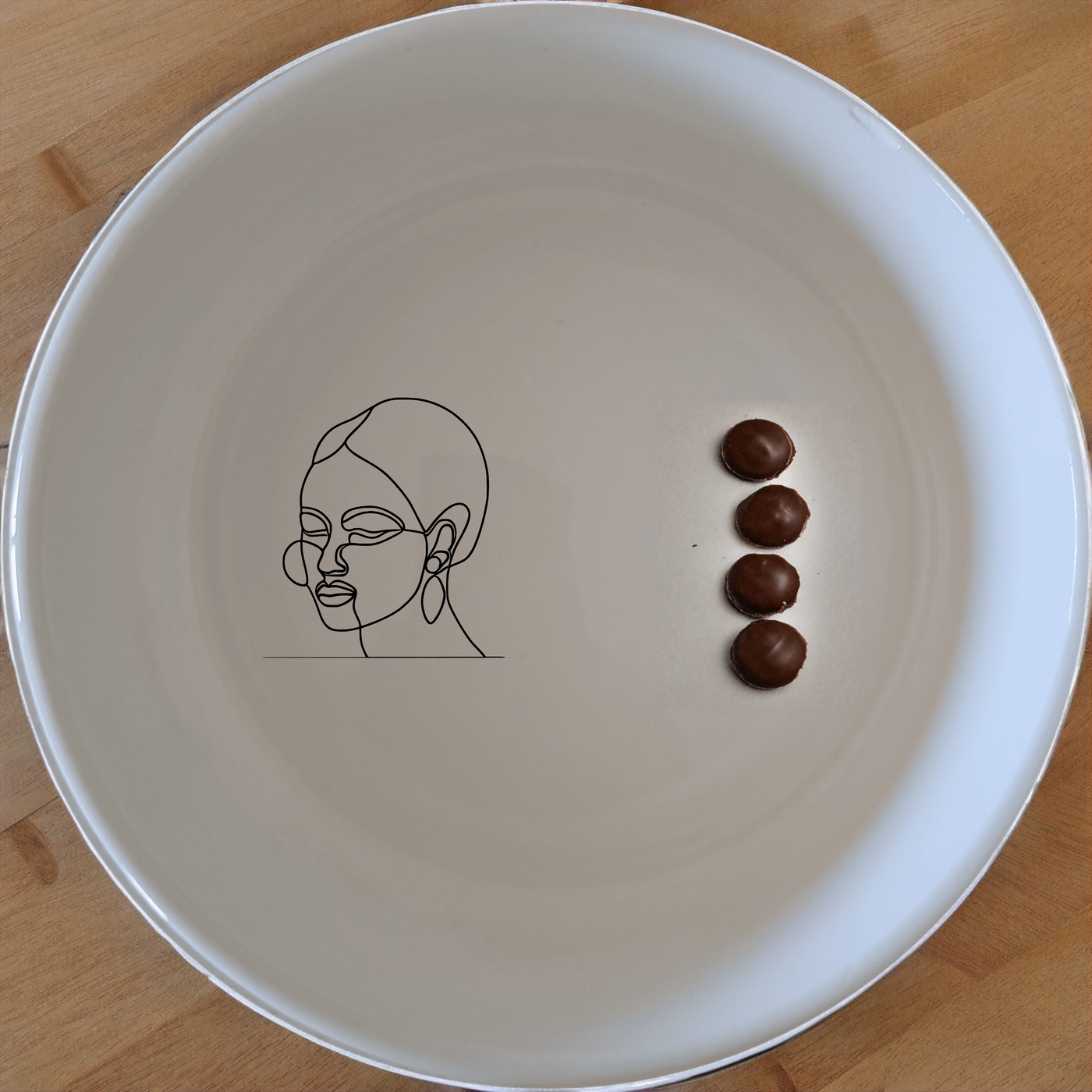 Face of Maasi Young Woman Bowl Set of 4 - Range 1 is a stunning and modern addition to any kitchen. This set features four beautifully designed bowls with a unique and artistic touch. Perfect for everyday use or special occasions, these bowls are sure to elevate your dining experience.