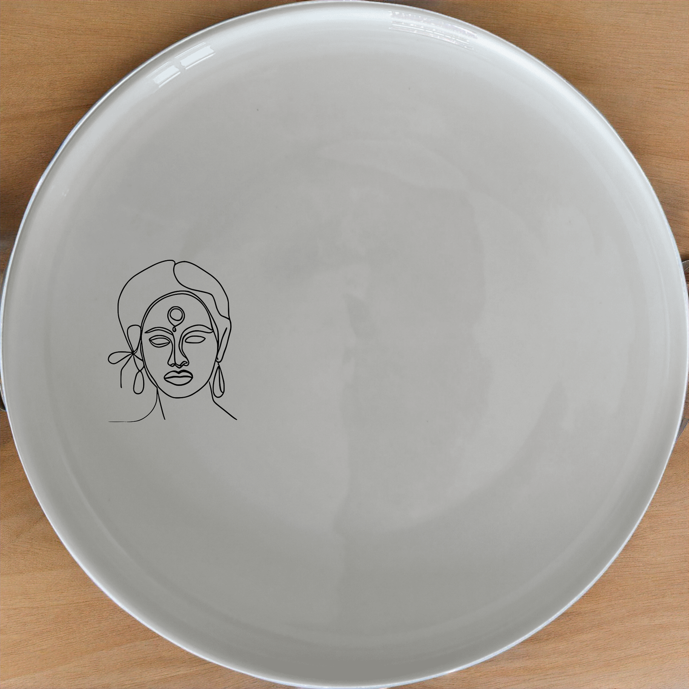 The Face Maasi Young Woman Dinner Plate Set of 4 brings cultural elegance to your dining table with its unique design.