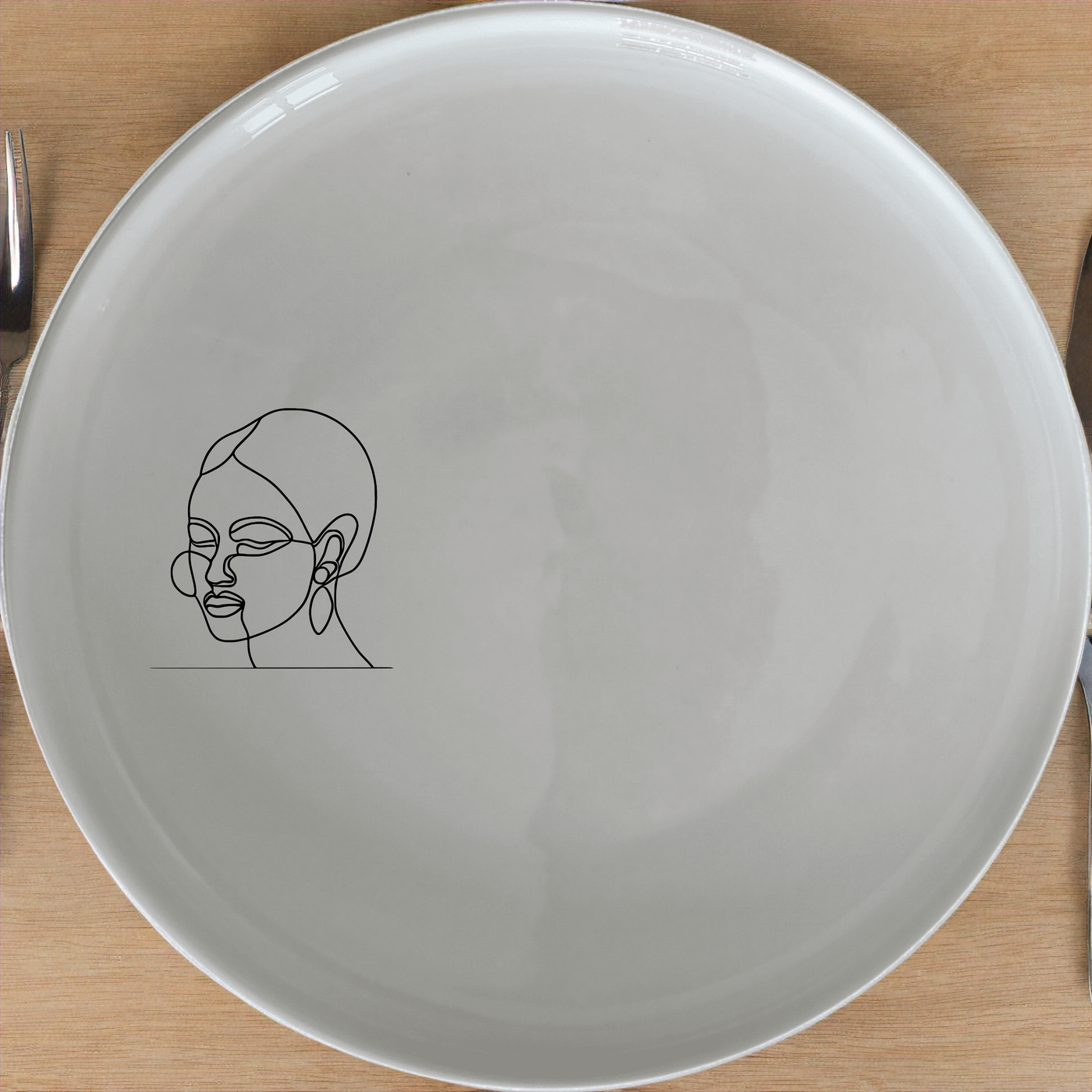 Face Of Maasi Young Woman Side Plate Set of 4 - Range 1 adds a modern touch to your dining table with its sleek design and artistic flair.
