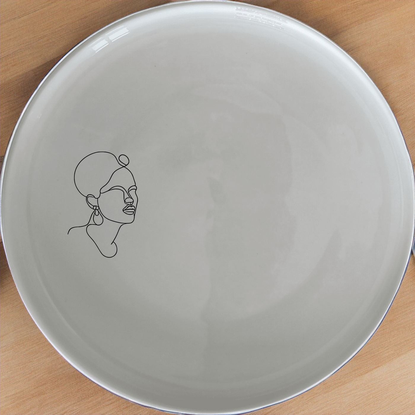 Face Of Maasi Young Woman Side Plate Set of 4 - Range 2 is a stunning collection of ceramic plates featuring elegant designs. Perfect for any dining occasion, these plates add a touch of sophistication to your table setting.