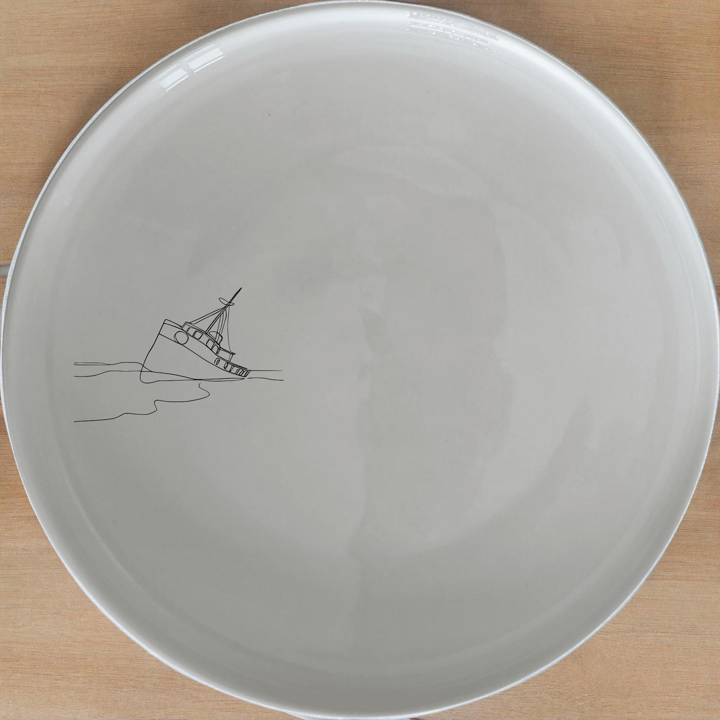 The Wreck Deserted Beach Side Plate Set of 4 - Range 1 is a captivating collection of ceramic plates featuring a minimalist shipwreck design, perfect for adding a touch of nautical charm to any dining setting.