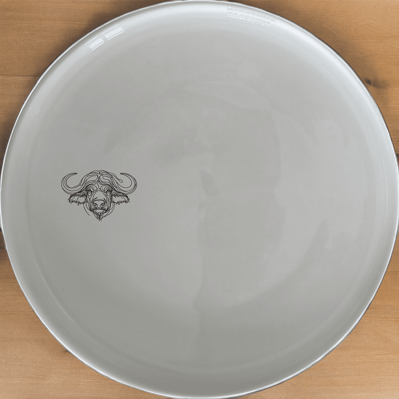 Staring Buffalo Side Plate Set of 4 - Range 1 is a stylish and modern addition to any dining table. Crafted from high-quality ceramic, these plates feature a sleek white finish and a subtle buffalo design, perfect for everyday use or special occasions.