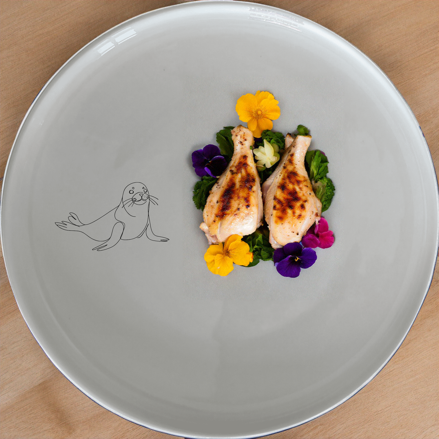 The Hand Drawn Harbour Seal Dinner Set of 12 brings a touch of coastal charm to your dining table with its charming harbor seal design.