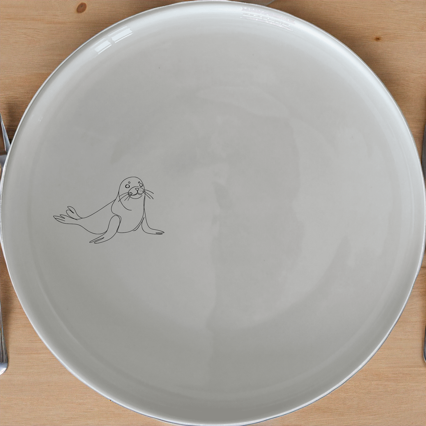 Harbour Seal Side Plate Set of 4 - Range 1 features charming harbour seal designs on elegant white ceramic plates.