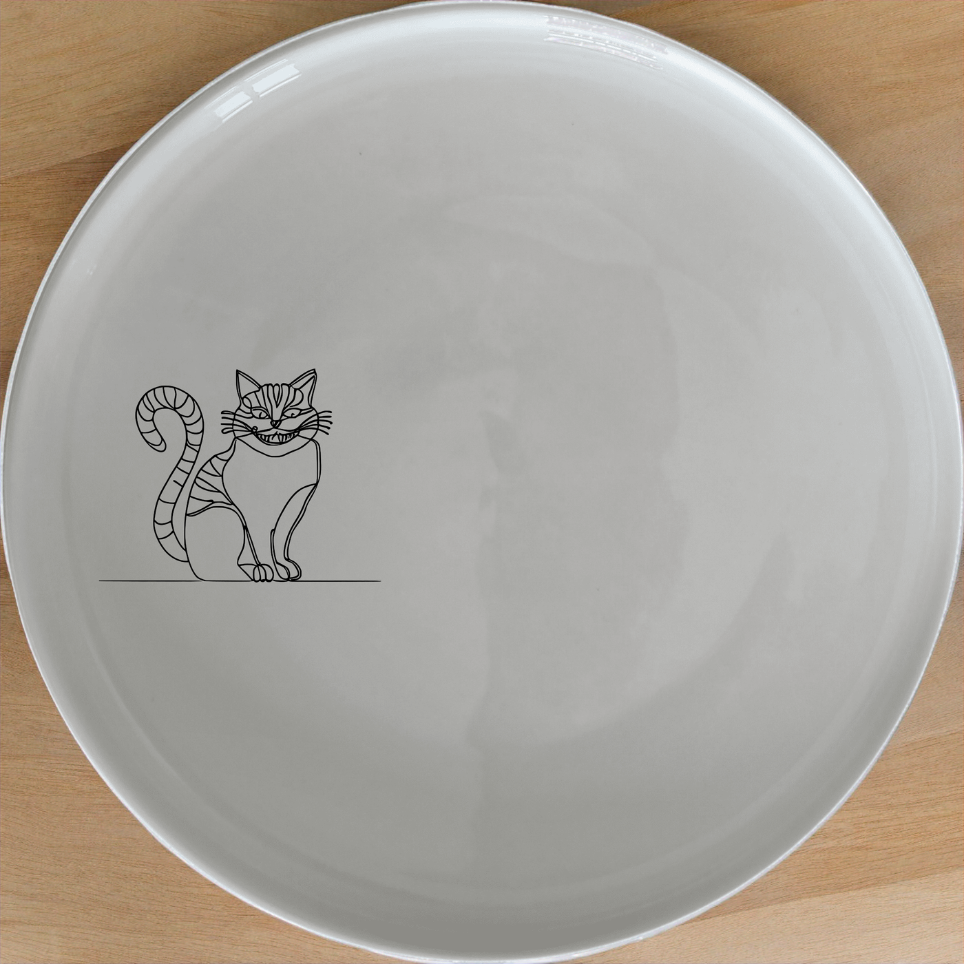 Cheshire Cat Side Plate Set of 4 - Range 3 is a charming addition to any dining set, featuring the iconic character in a minimalist design.