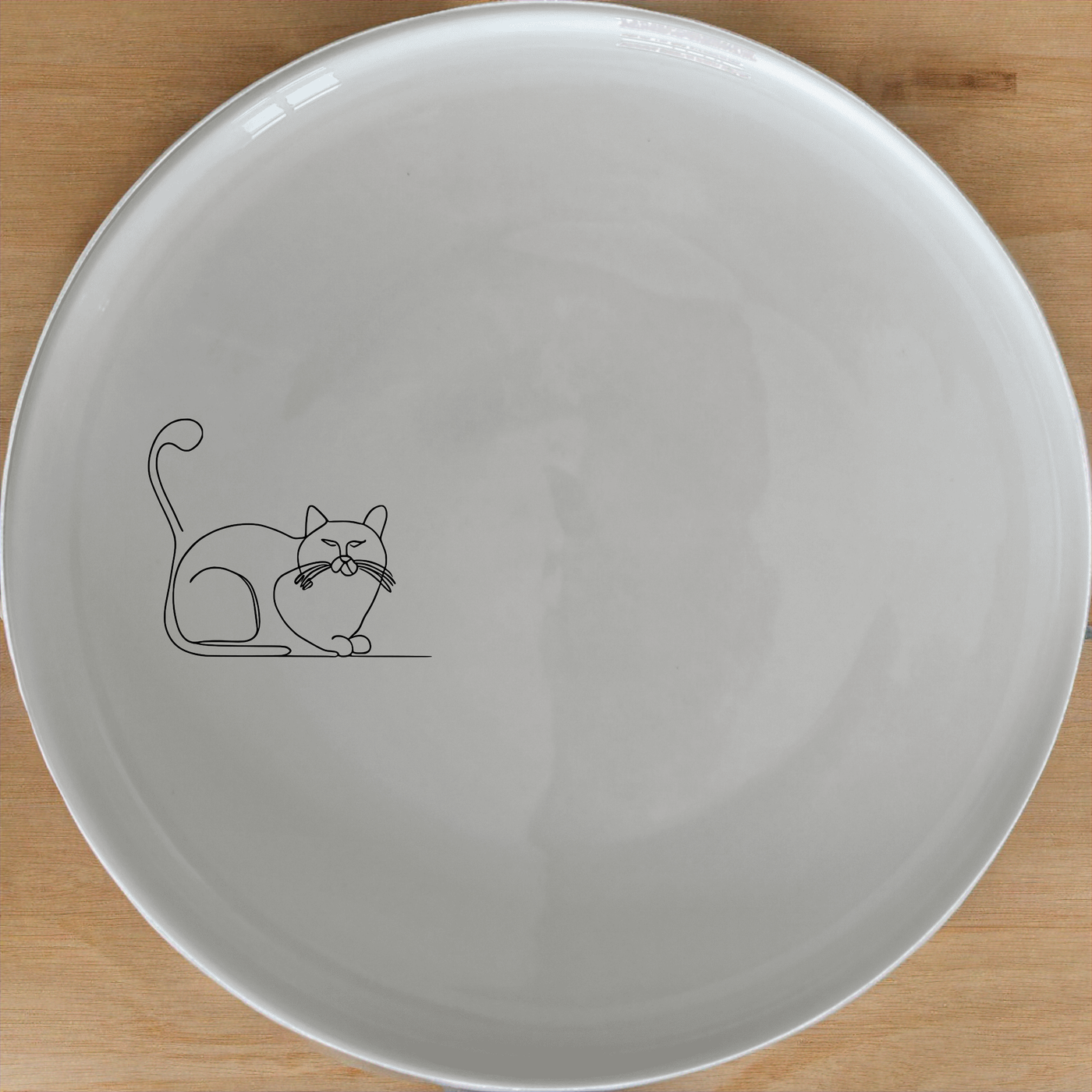 Grumpy Fat Cat Side Plate Set of 4 - Range 3 is a charming and stylish addition to any dining table. Perfect for cat lovers, these plates feature a detailed illustration of a grumpy fat cat in a relaxed pose. Crafted from high-quality ceramic, they are both microwave and dishwasher safe, making them ideal for everyday use. The set includes four plates, each measuring 21cm in diameter, and is presented in an elegant white finish.