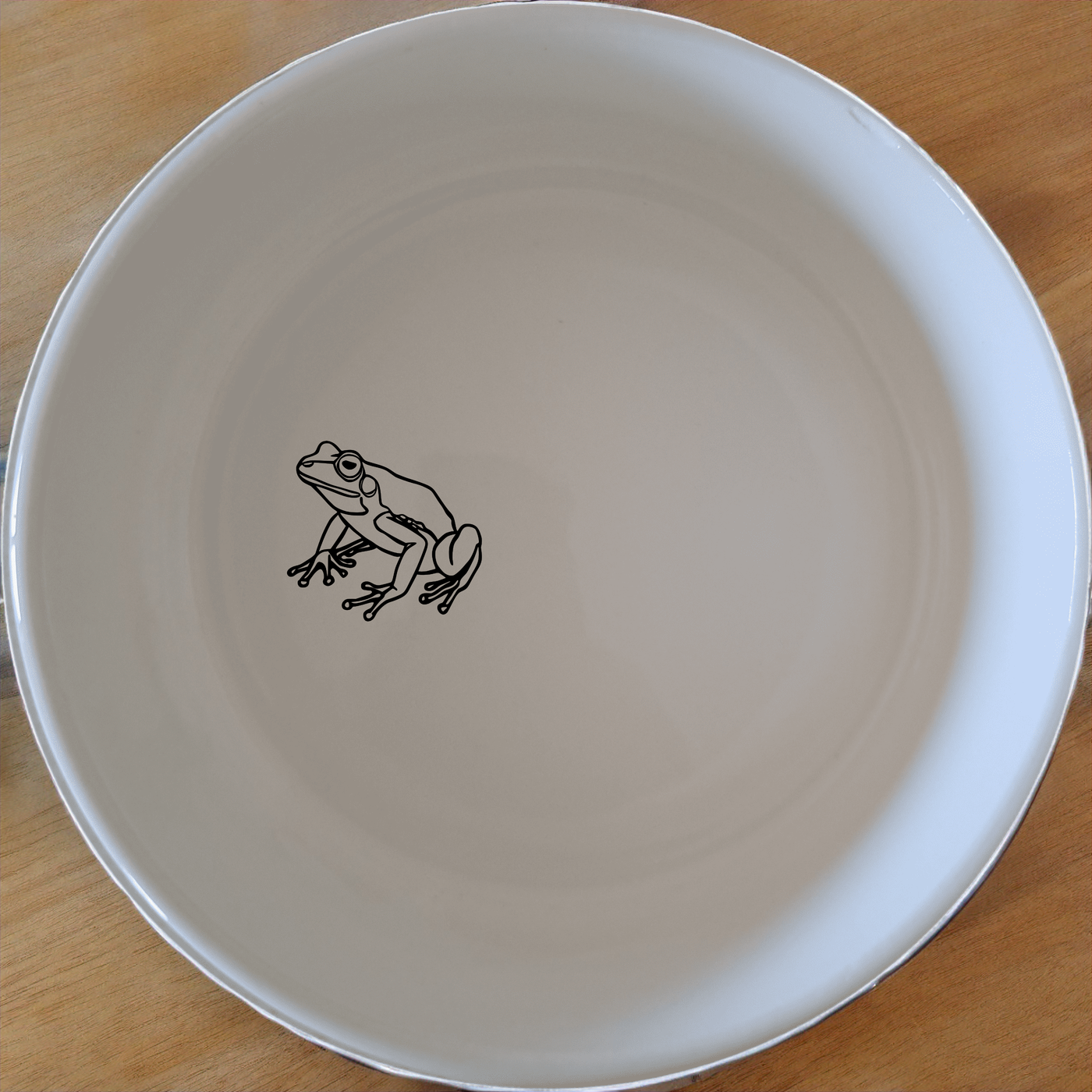 Frogs Reptiles Bowl Set of 4 - Range 2 is a charming set of four ceramic bowls, each featuring a delightful frog design. Perfect for everyday use or as a gift.