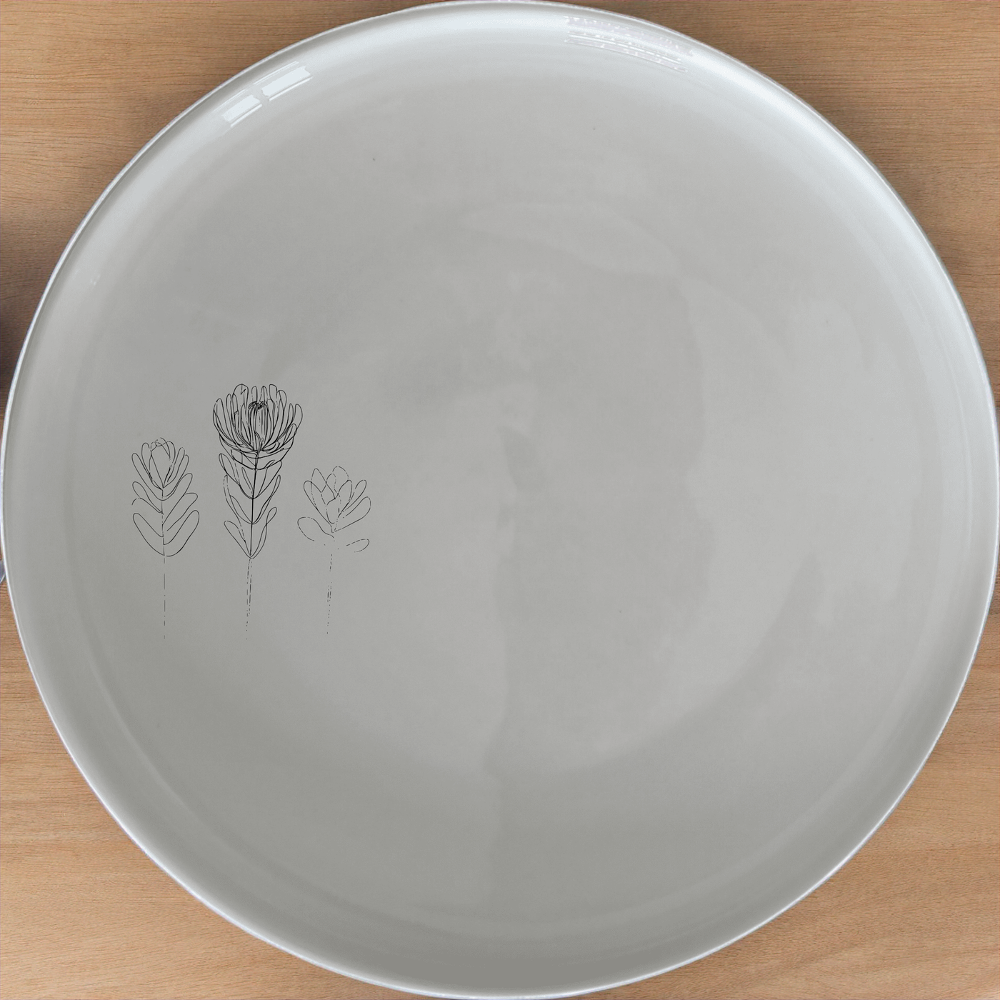 Fynbos Collection Side Plate Set of 4 - Range 2 adds a touch of nature to your dining table with delicate botanical illustrations.