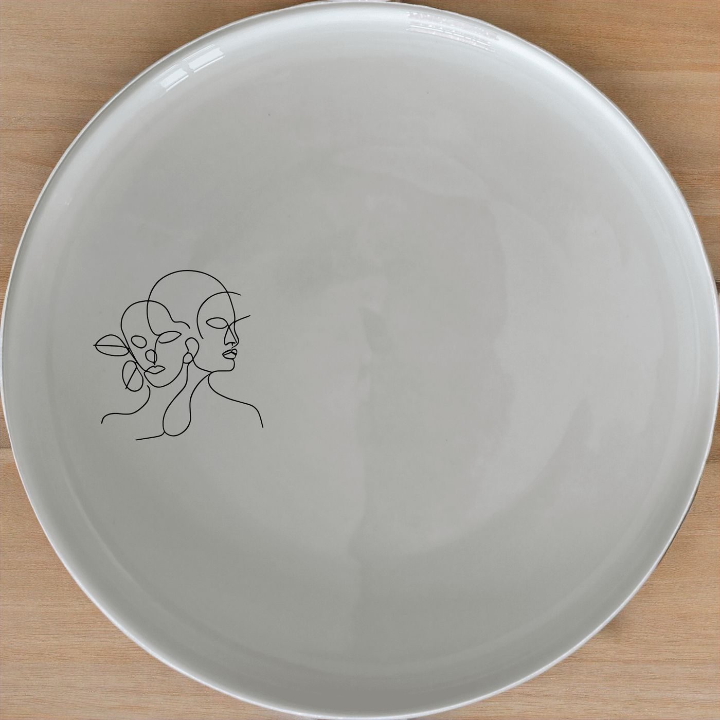 Faces Art Side Plate Set of 4 - Range 3 adds a modern touch to your dining table with abstract line art designs.