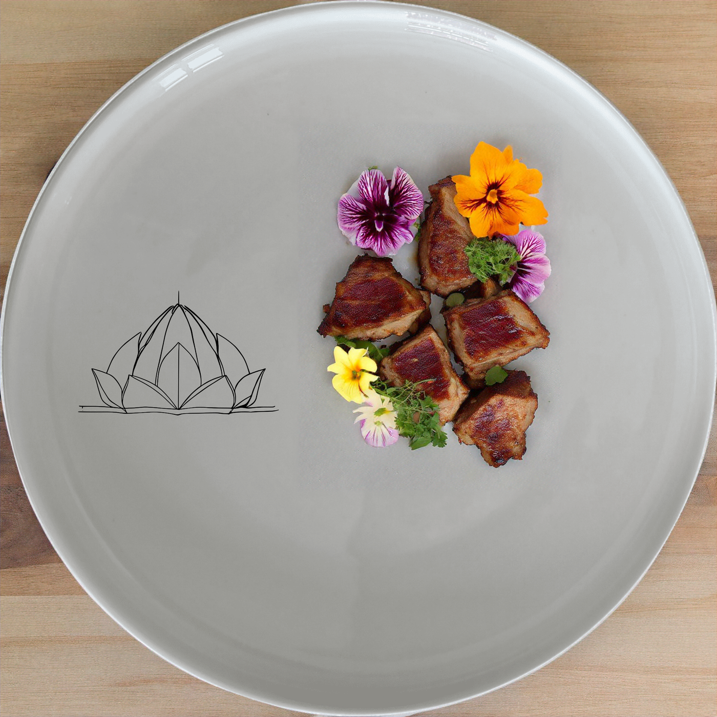 The Lotus Temple Watercolour Dinner Set of 12 - Range 2 brings artistic elegance to your dining table with its delicate lotus temple design.