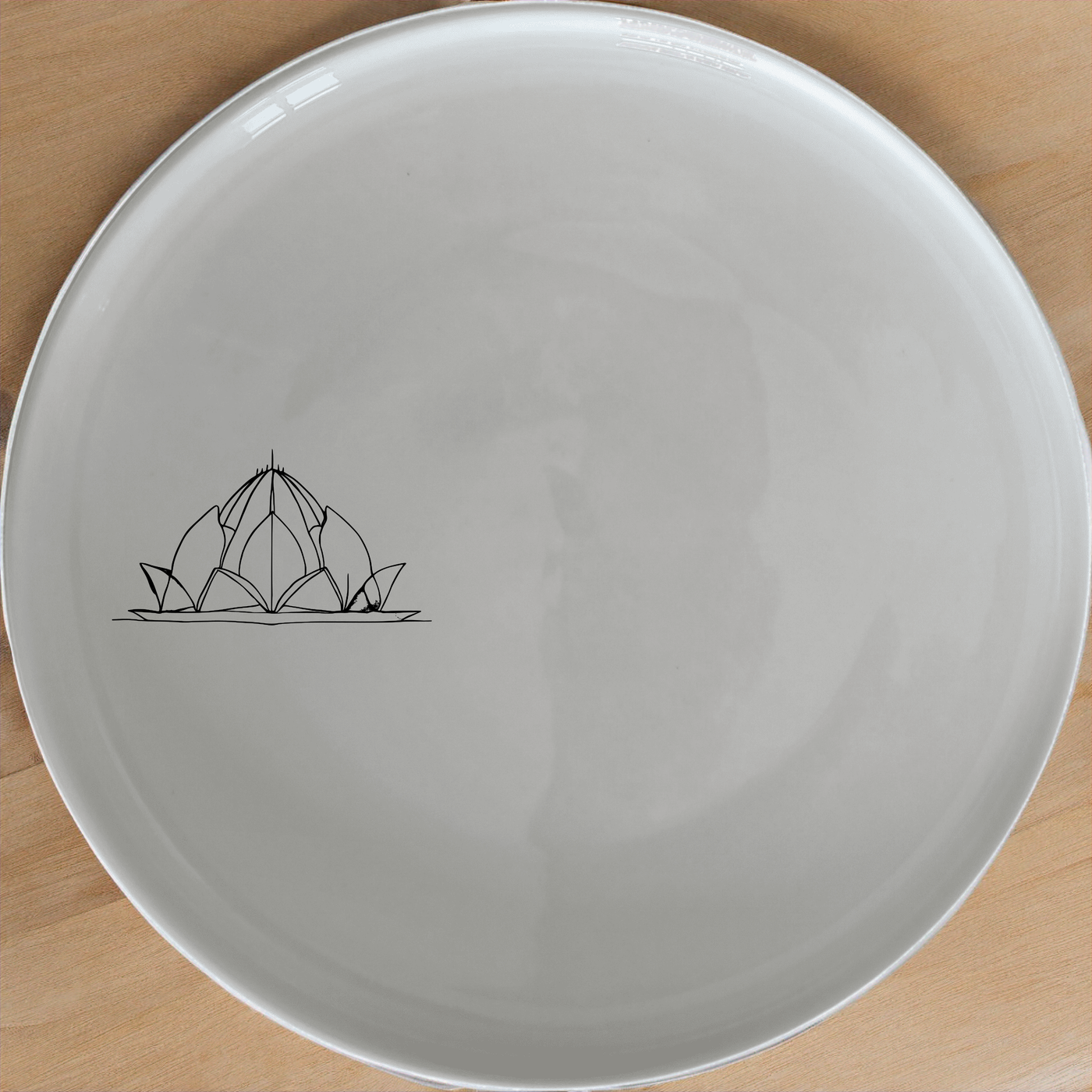 This Lotus Temple Watercolour Side Plate Set of 4 features delicate artwork perfect for any dining table. Each plate showcases a beautiful lotus temple design in a subtle, elegant style.
