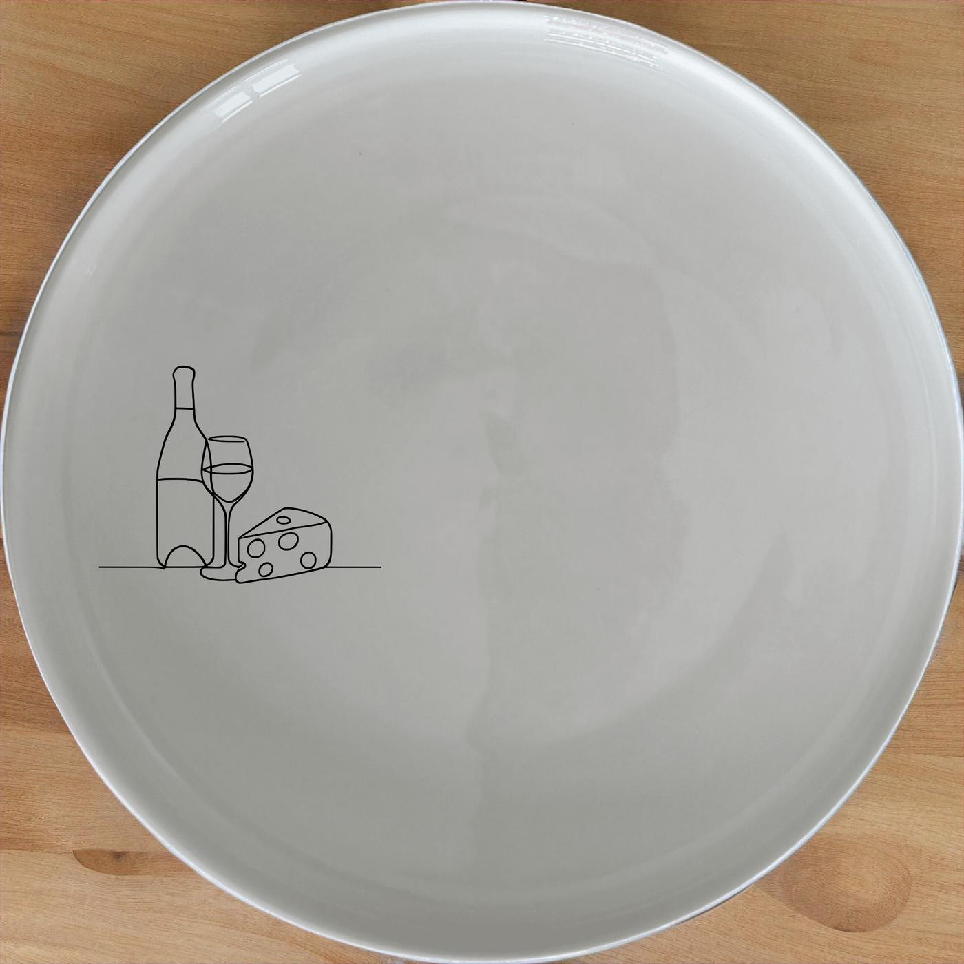 This Wine and Cheese Dinner Plate Set of 4 features a minimalist design perfect for any dining occasion. Crafted from durable ceramic, these plates are microwave and dishwasher safe. Ideal for both everyday use and special events.