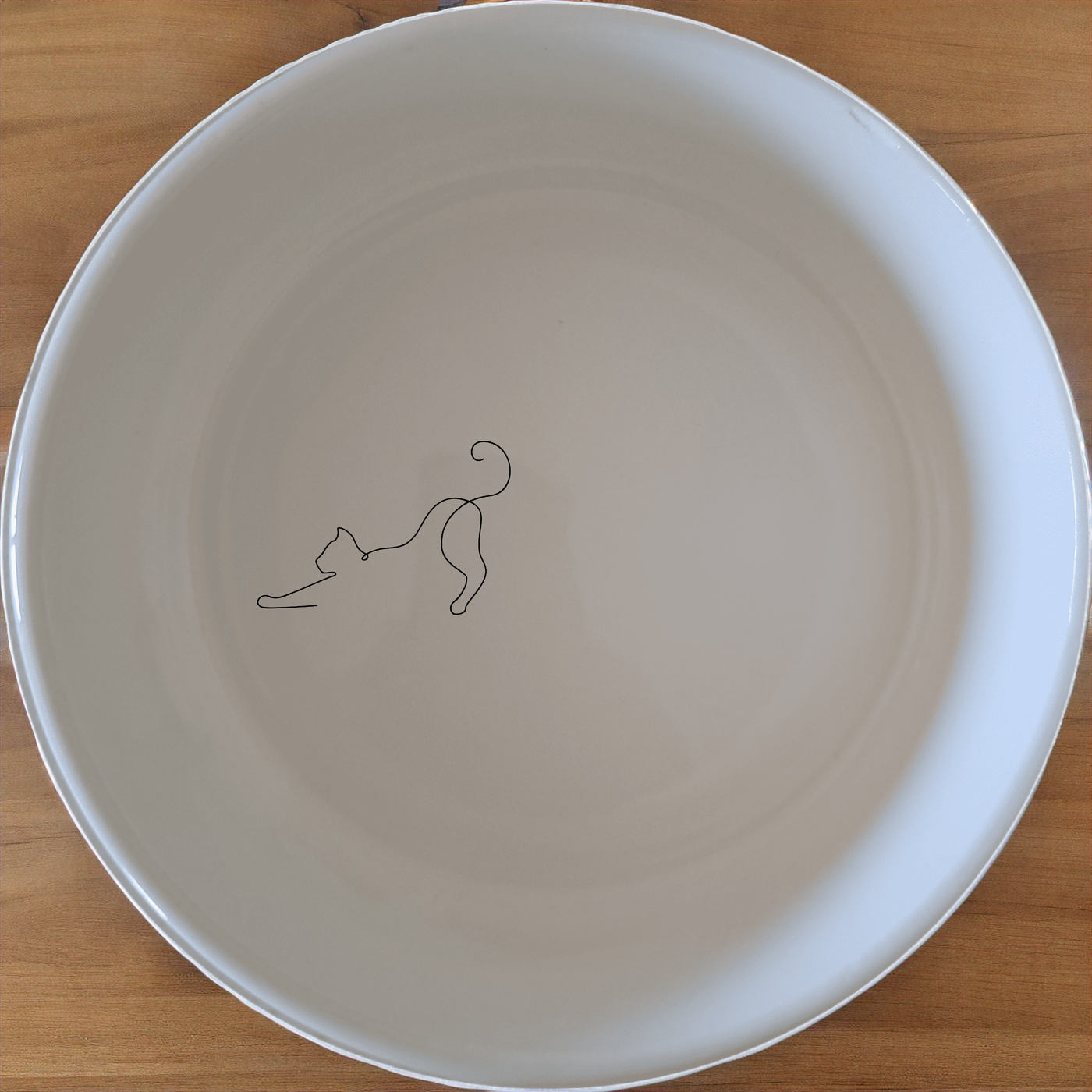 Stretching Cat Bowl Set of 4 - Range 1 is a charming and practical addition to any pet's daily routine. Crafted from durable ceramic, these bowls feature an elegant design with a subtle cat silhouette. Ideal for both dry and wet food, they are dishwasher and microwave safe for easy cleaning and reheating. Perfect for pet owners who appreciate both style and functionality in their pet care essentials.