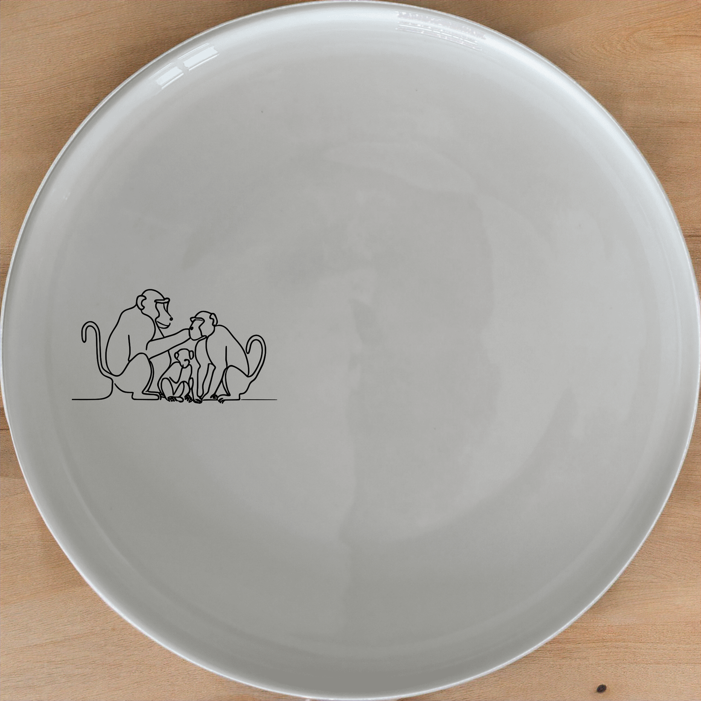 Baboon Troop Social Dinner Plate Set of 4 - Range 3 is a charming and unique dinnerware set featuring a detailed illustration of a baboon troop in social grooming. Perfect for adding a touch of nature to your dining experience.