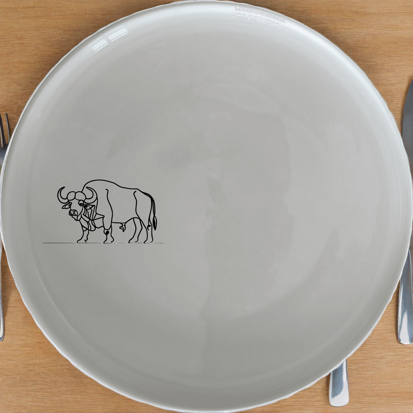 Buffalo Herd Side Plate Set of 4 - Range 2 offers a bold, artistic design perfect for modern dining. Crafted from durable ceramic, these plates feature a striking buffalo illustration that adds a touch of nature to any table setting. Ideal for everyday use or special occasions, this set combines style and functionality in a compact, easy-to-clean design.