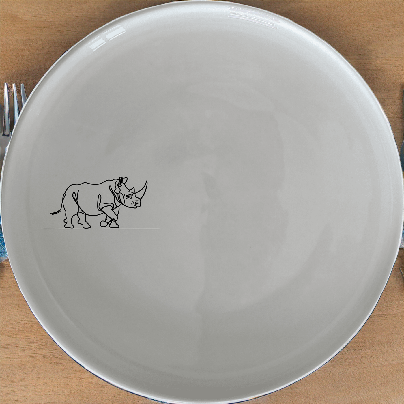 Charging Rhino Horn Dinner Plate Set of 4 - Range 1 is a stylish and elegant dinner plate set featuring a charging rhino horn design. Perfect for any dining occasion.