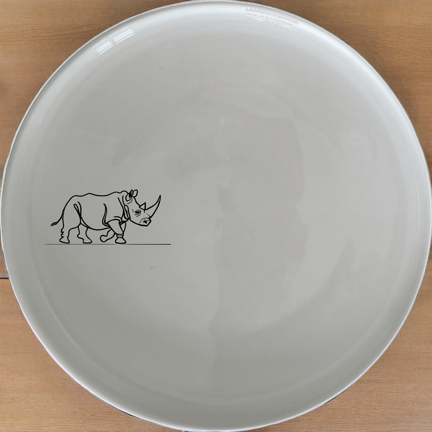 Charging Rhino Horn Dinner Plate Set of 4 - Range 28 offers a bold and striking design perfect for modern dining.