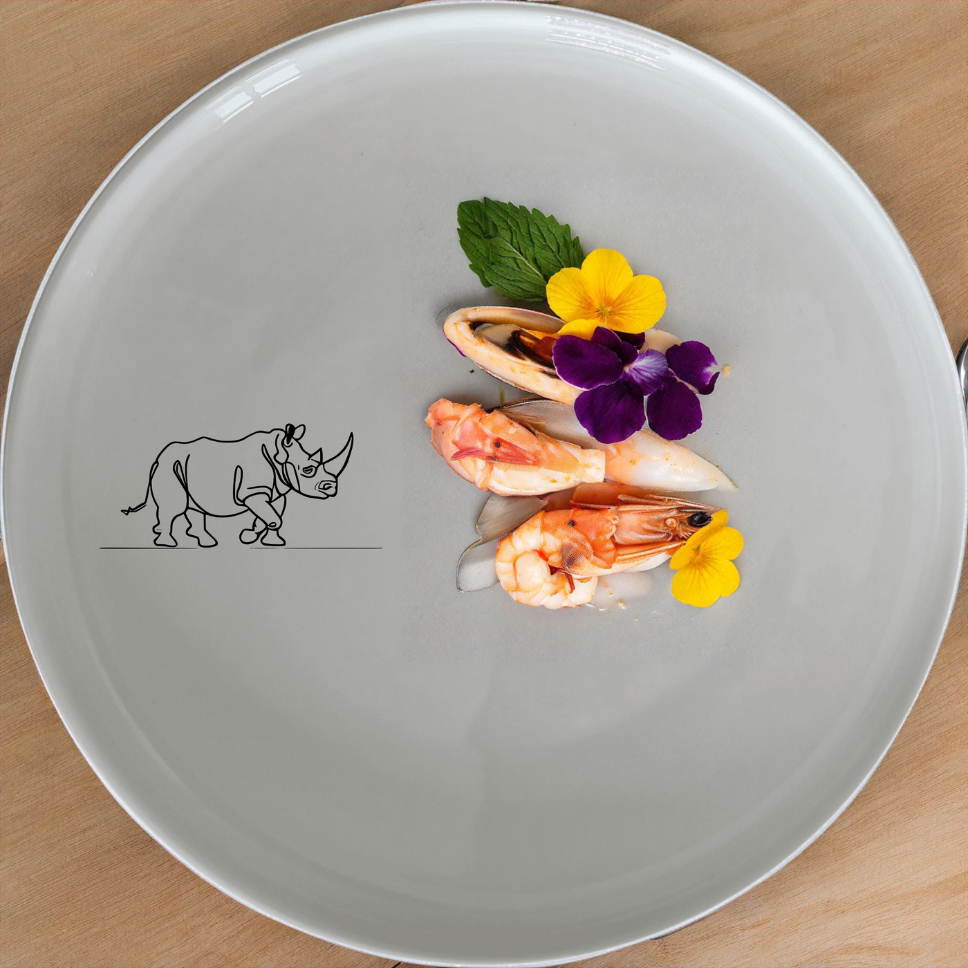 Charging Rhino Horn Side Plate Set of 4 - Range 1 adds a bold touch to your table setting with striking rhino artwork.