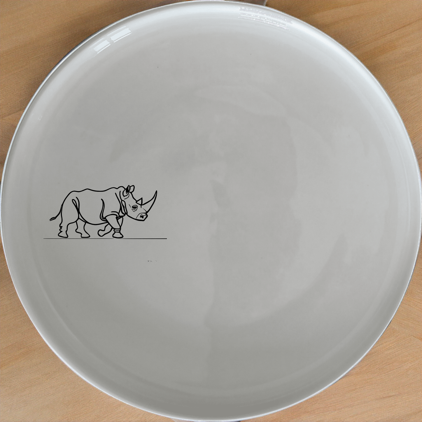 Charging Rhino Horn Side Plate Set of 4 - Range 1 is a stylish and modern dinnerware set featuring a bold rhino design. Perfect for everyday use or special occasions.