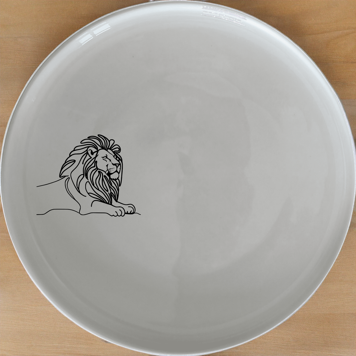 Crouching Lion Dinner Plate Set of 4 - Range 1 is a stylish and modern dinner plate set featuring a sleek lion design, perfect for any dining occasion.