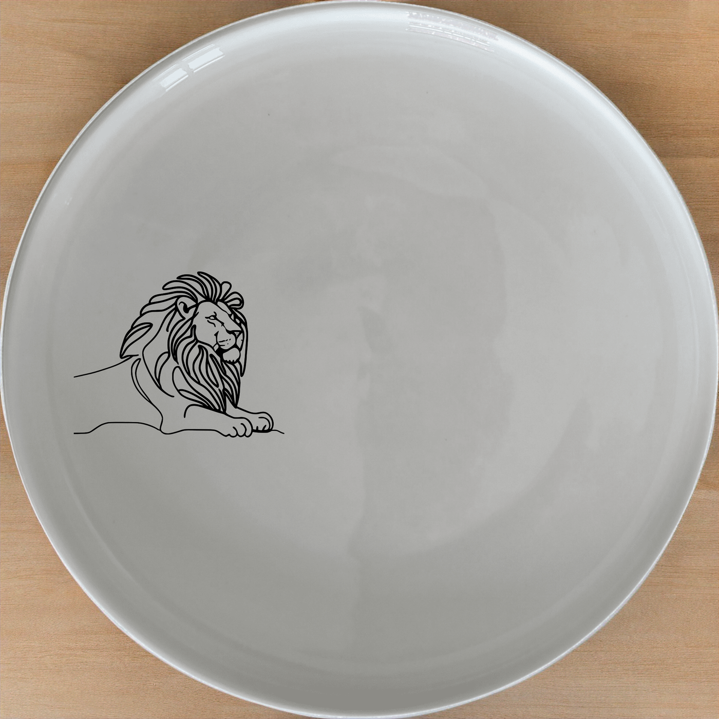 Crouching Lion Side Plate Set of 4 - Range 1 offers a sleek, modern design perfect for any dining table. This set of four plates features an artistic depiction of a crouching lion, adding a touch of sophistication to your home decor. Crafted from high-quality ceramic, these plates are durable, dishwasher-safe, and microwave-safe, making them ideal for everyday use or special occasions.