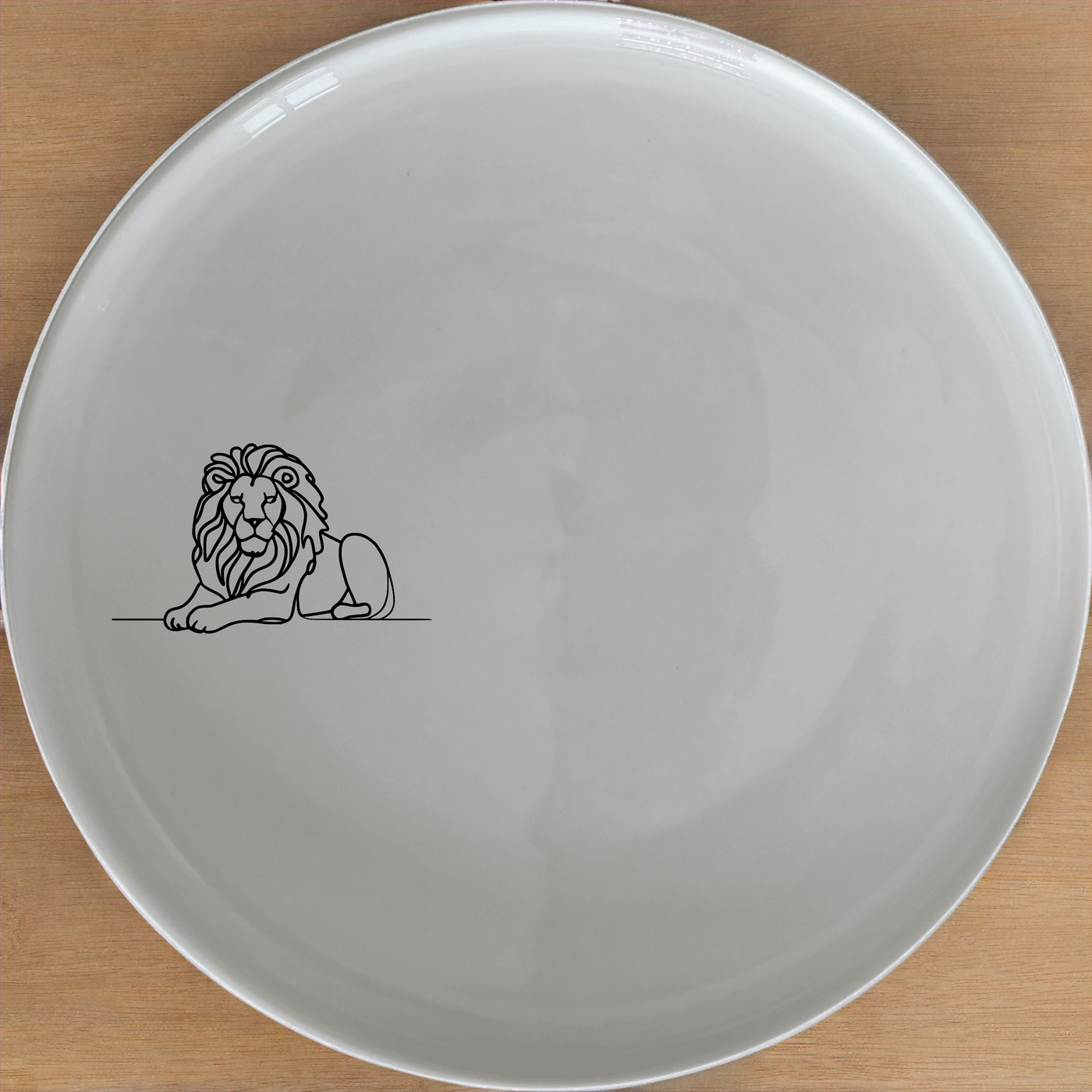 The Crouching Lion Side Plate Set of 4 - Range 2 features a sleek, minimalist design perfect for modern dining. Crafted from premium ceramic, these plates are both durable and dishwasher-safe, making them ideal for everyday use or special occasions.