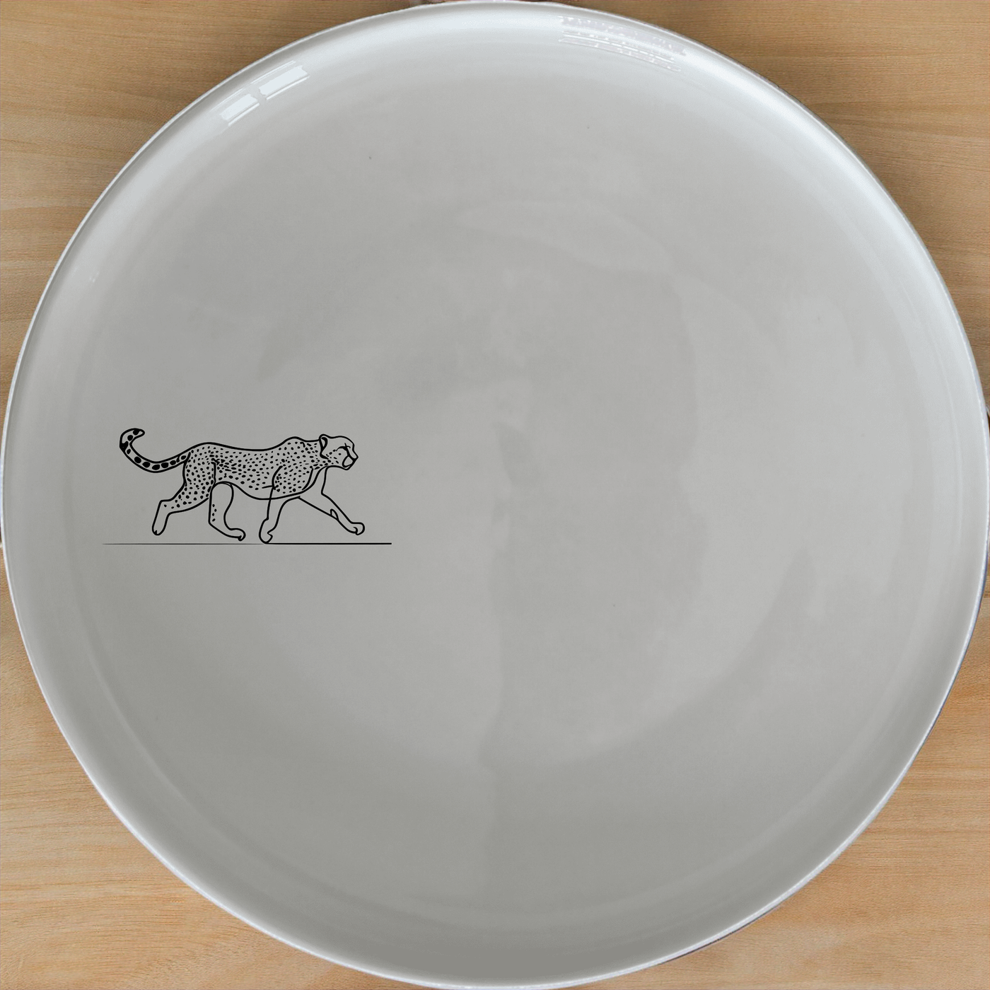 The Graceful Cheetah Dinner Plate Set of 4 - Range 4 features sleek cheetah designs on white ceramic plates, perfect for modern dining.