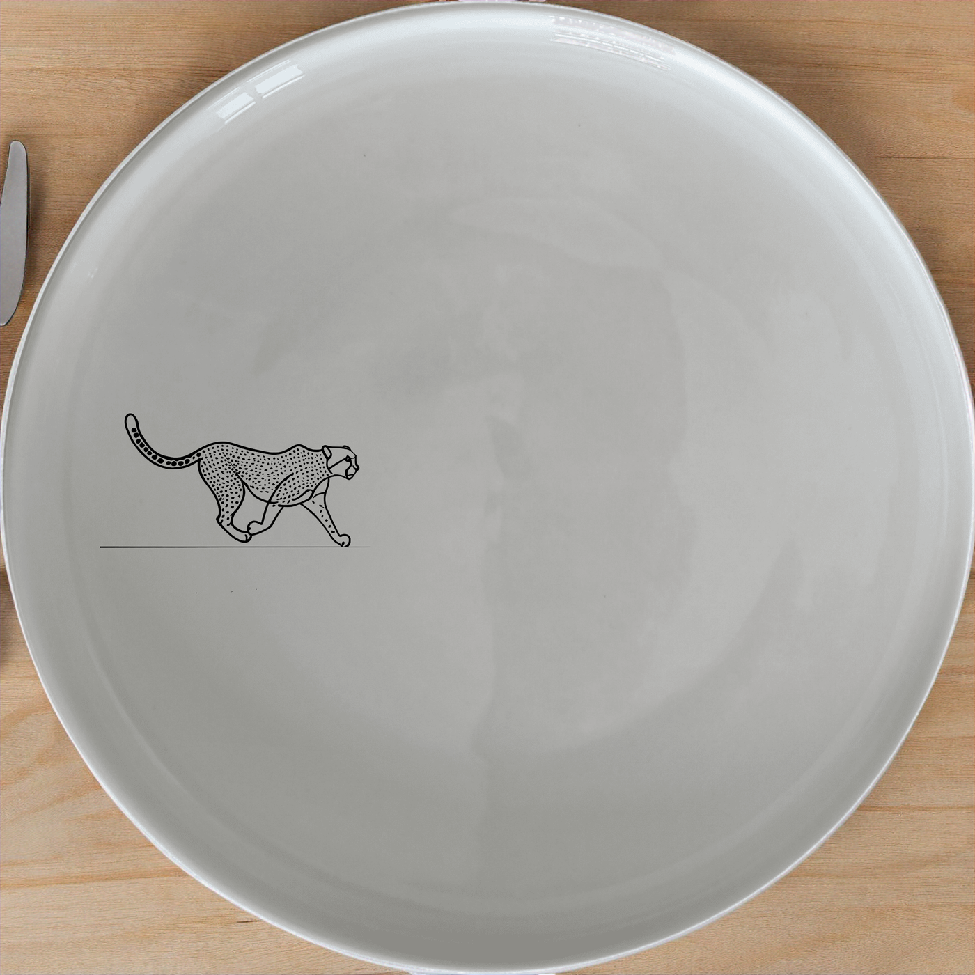 The Graceful Cheetah Side Plate Set of 4 - Range 1 features sleek cheetah designs on elegant white ceramic plates, perfect for modern dining.