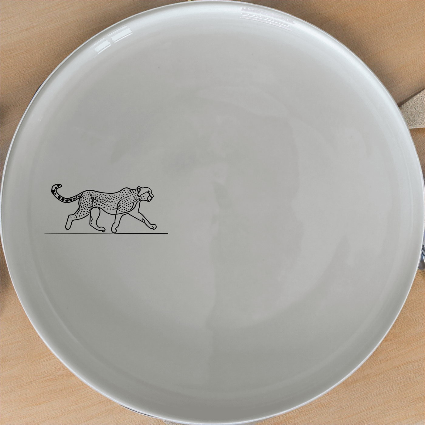 The Graceful Cheetah Side Plate Set of 4 - Range 4 features sleek cheetah designs on white ceramic plates, perfect for modern dining.