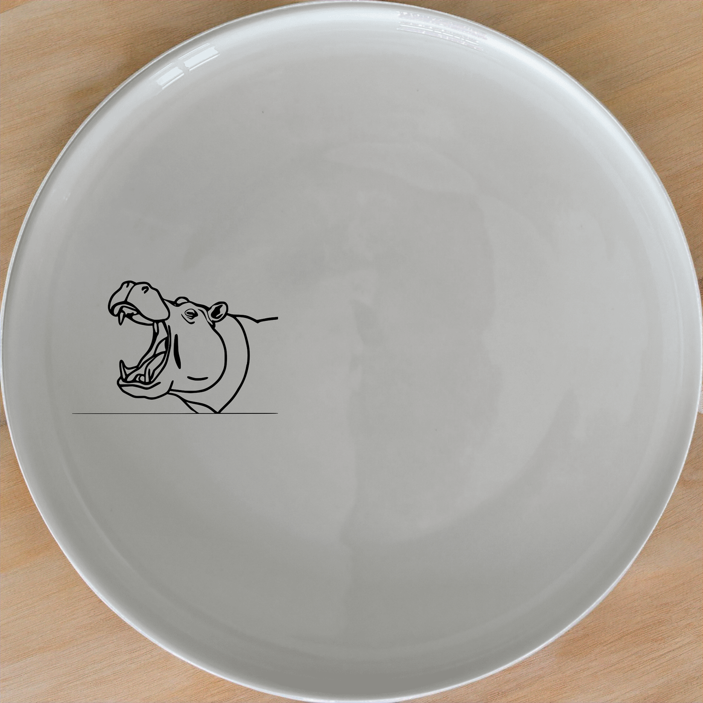 The Hippo Yawning Massive Jaw Side Plate Set of 4 - Range 1 adds a bold, artistic touch to your dining table with its striking design.