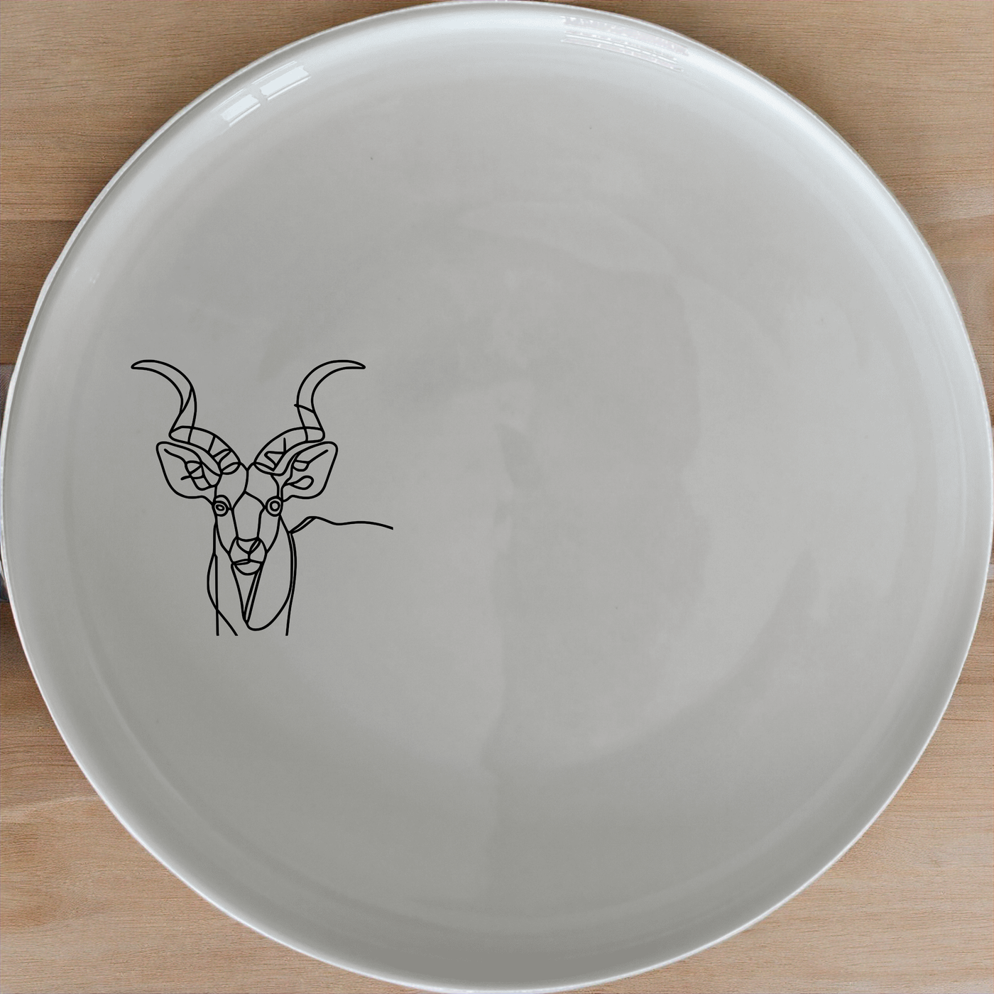 The Kudu Antelope Dinner Plate Set of 4 - Range 1 features elegant designs perfect for any dining occasion. Crafted from premium ceramic, these plates are both microwave and dishwasher safe. Ideal for modern homes.
