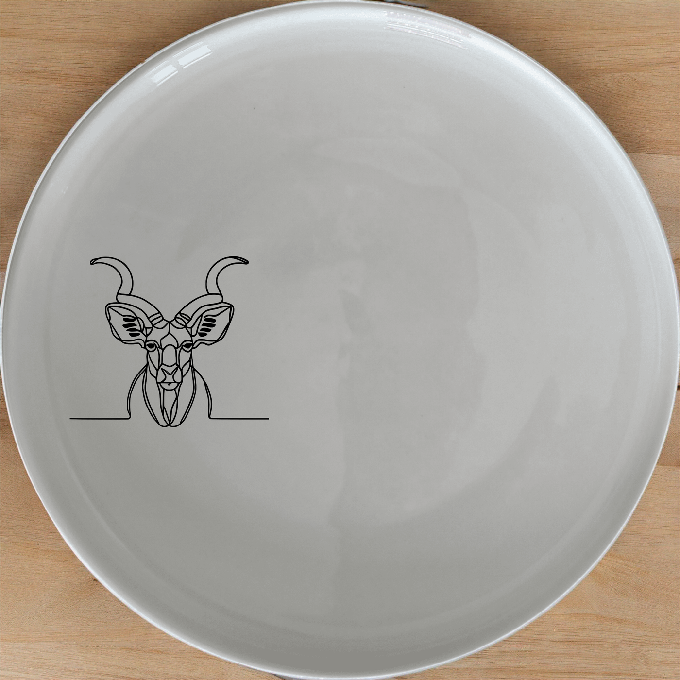 Kudu Antelope Dinner Plate Set of 4 - Range 4 is a stunning set of four elegant dinner plates featuring a sleek antelope design.
