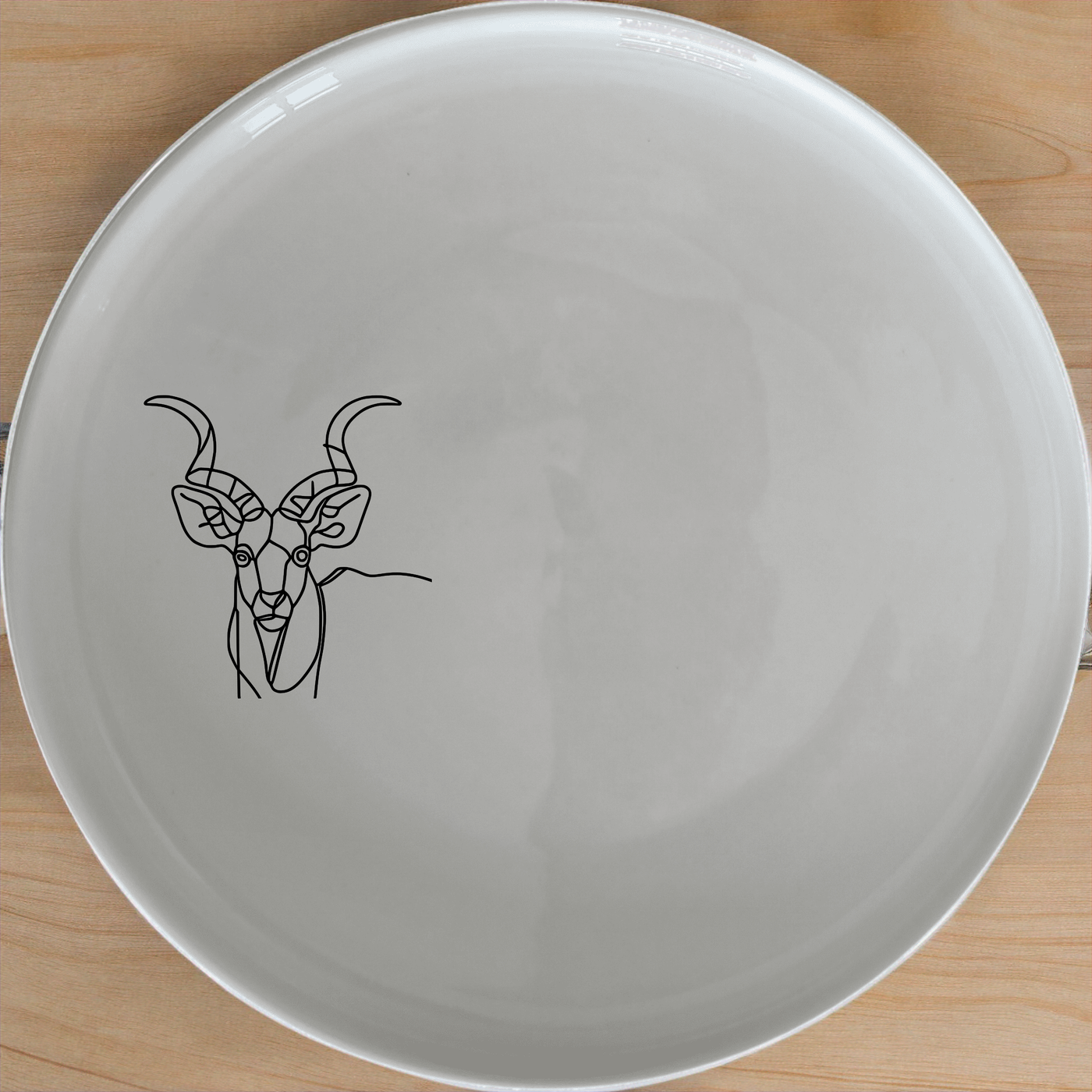 Kudu Antelope Spiral Horns Side Plate Set of 4 - Range 1 adds a touch of elegance to your dining table with its unique design.