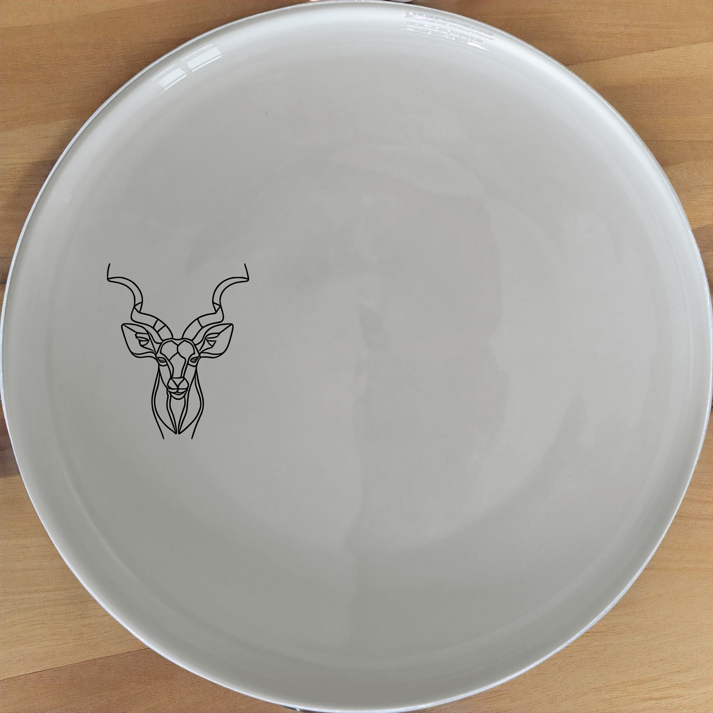 Kudu Antelope Side Plate Set of 4 - Range 2 adds a touch of elegance to your dining table with its unique design and high-quality ceramic construction.