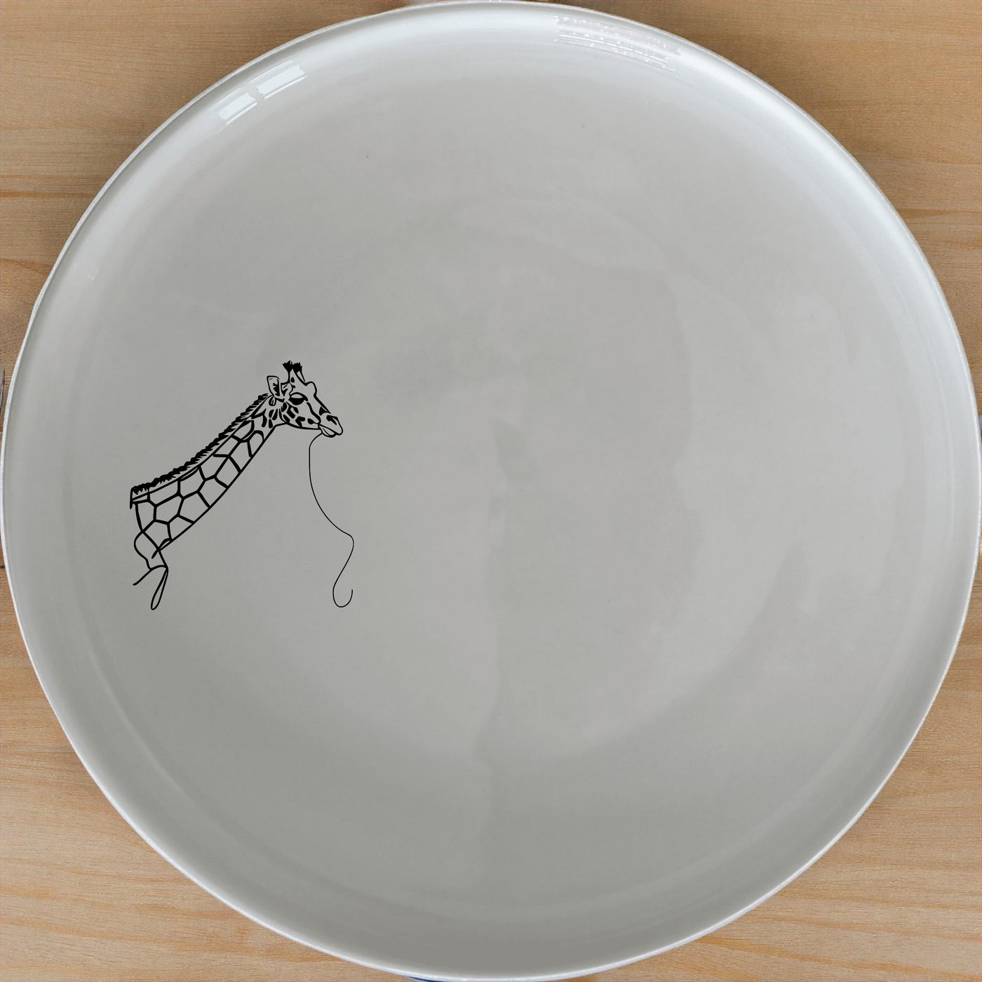 Majestic Giraffe Dinner Plate Set of 4 - Range 2 is a stylish and unique dinnerware set featuring elegant giraffe illustrations, perfect for adding a touch of nature to your dining experience.