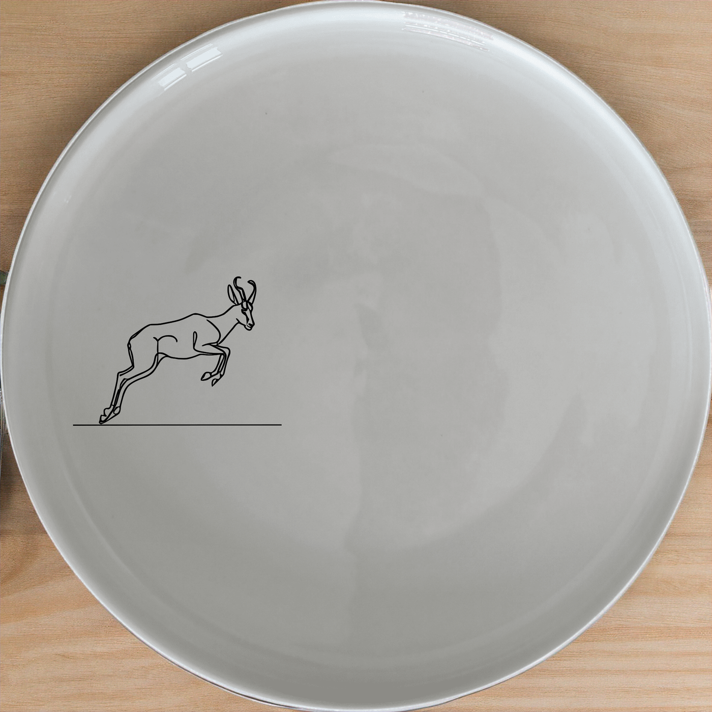 Springbok Leaping Dinner Plate Set of 4 - Range 1 is a stunning collection of ceramic plates featuring an elegant leaping antelope design. Perfect for any dining occasion.