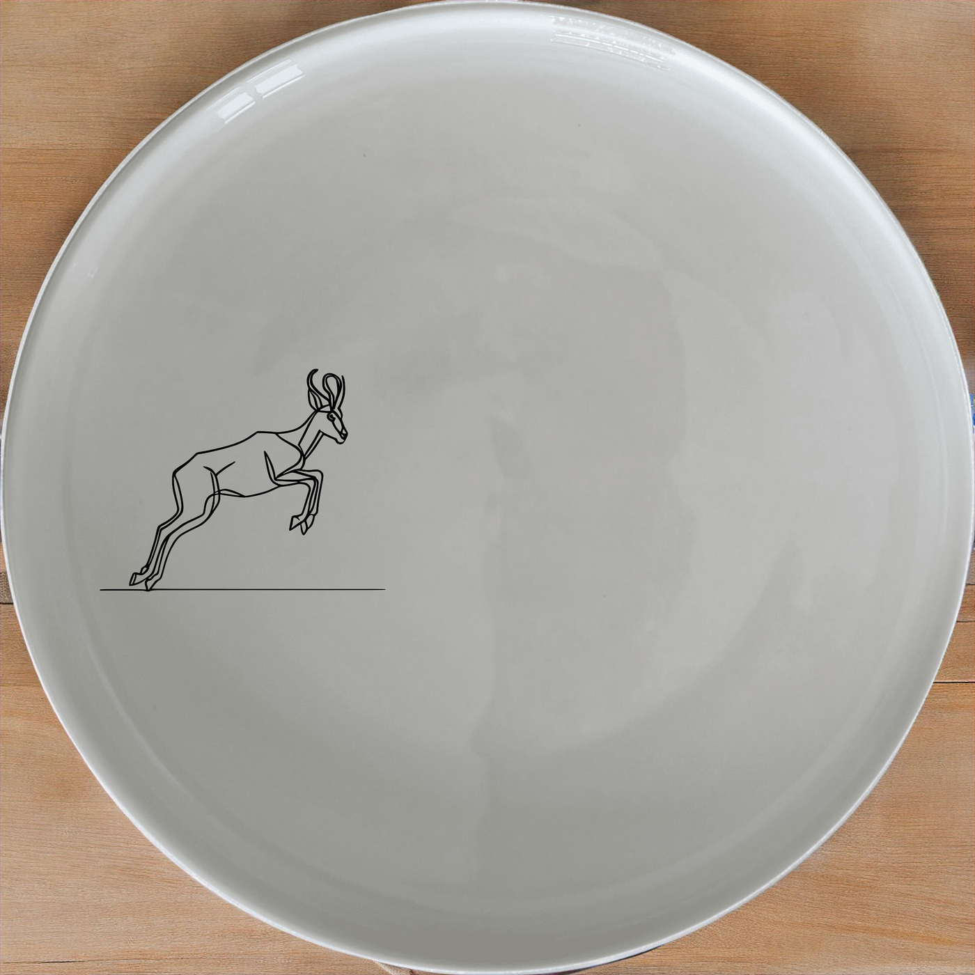 Springbok Leaping Dinner Plate Set of 4 - Range 4 features a dynamic leaping antelope design, perfect for modern dining.