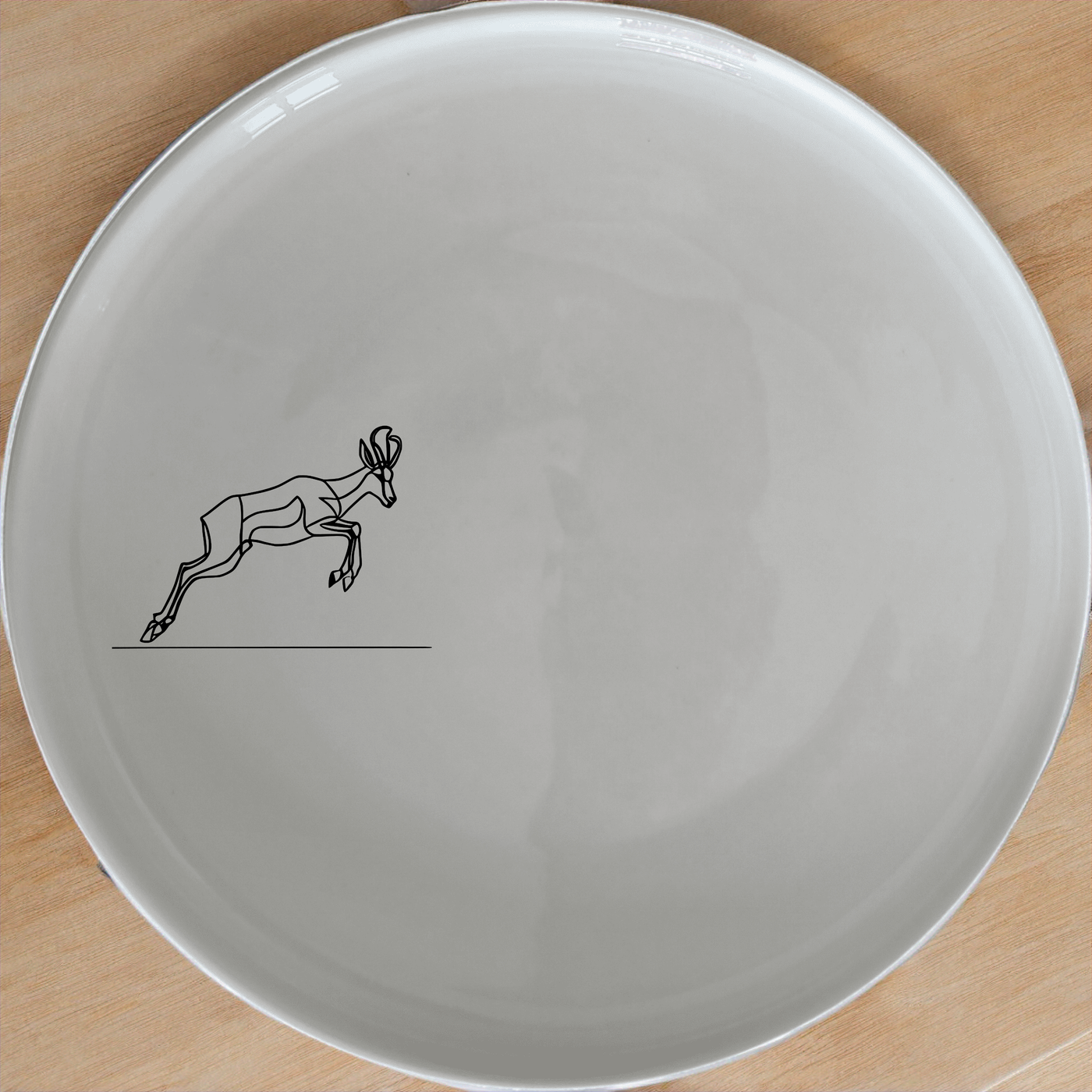 Springbok Leaping Dinner Plate Set of 4 - Range 4 adds a touch of nature to your dining table with elegant antelope designs.