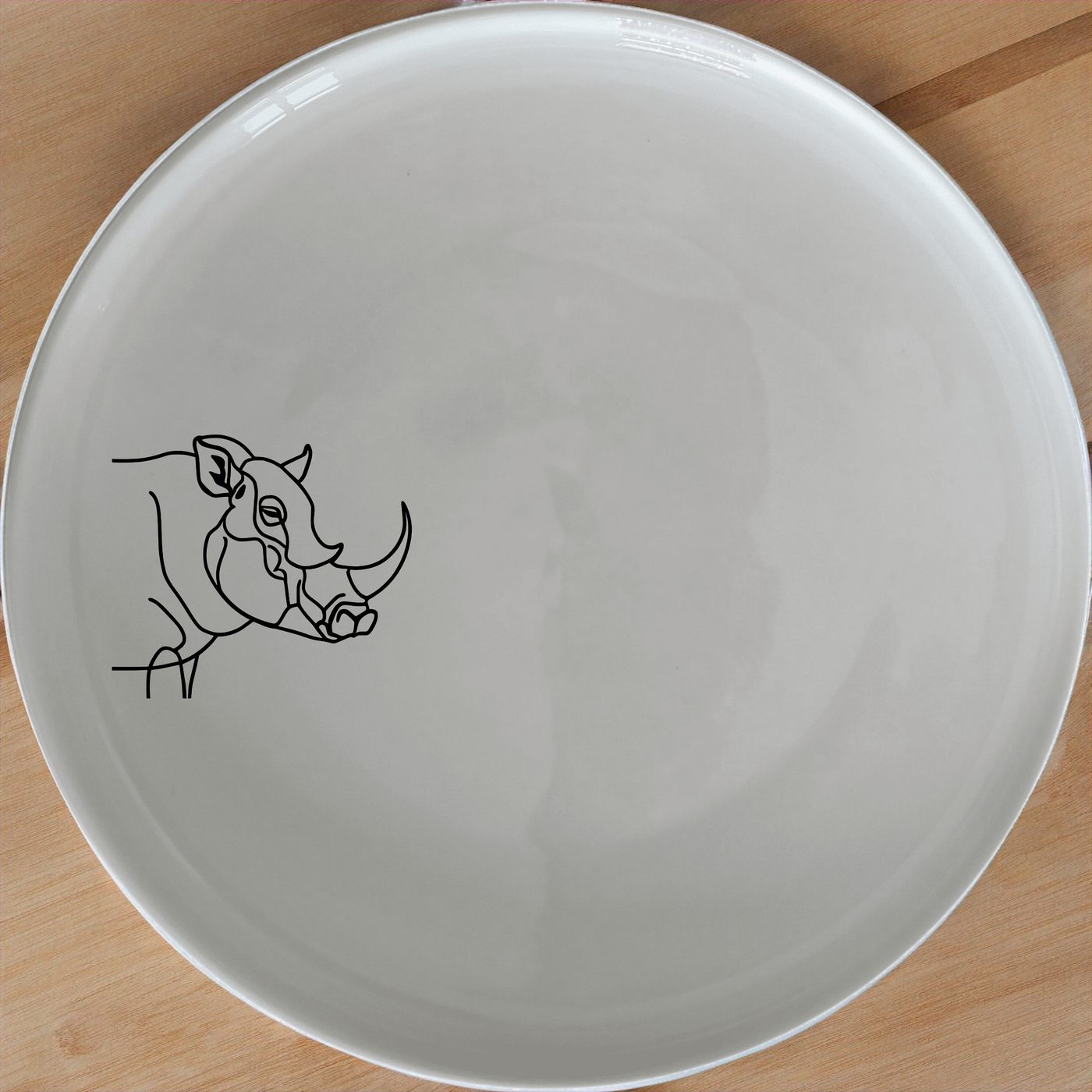 Warthog Tusk Dinner Plate Set of 4 - Range 1 adds a unique touch to your dining table with its elegant design and durable ceramic construction.